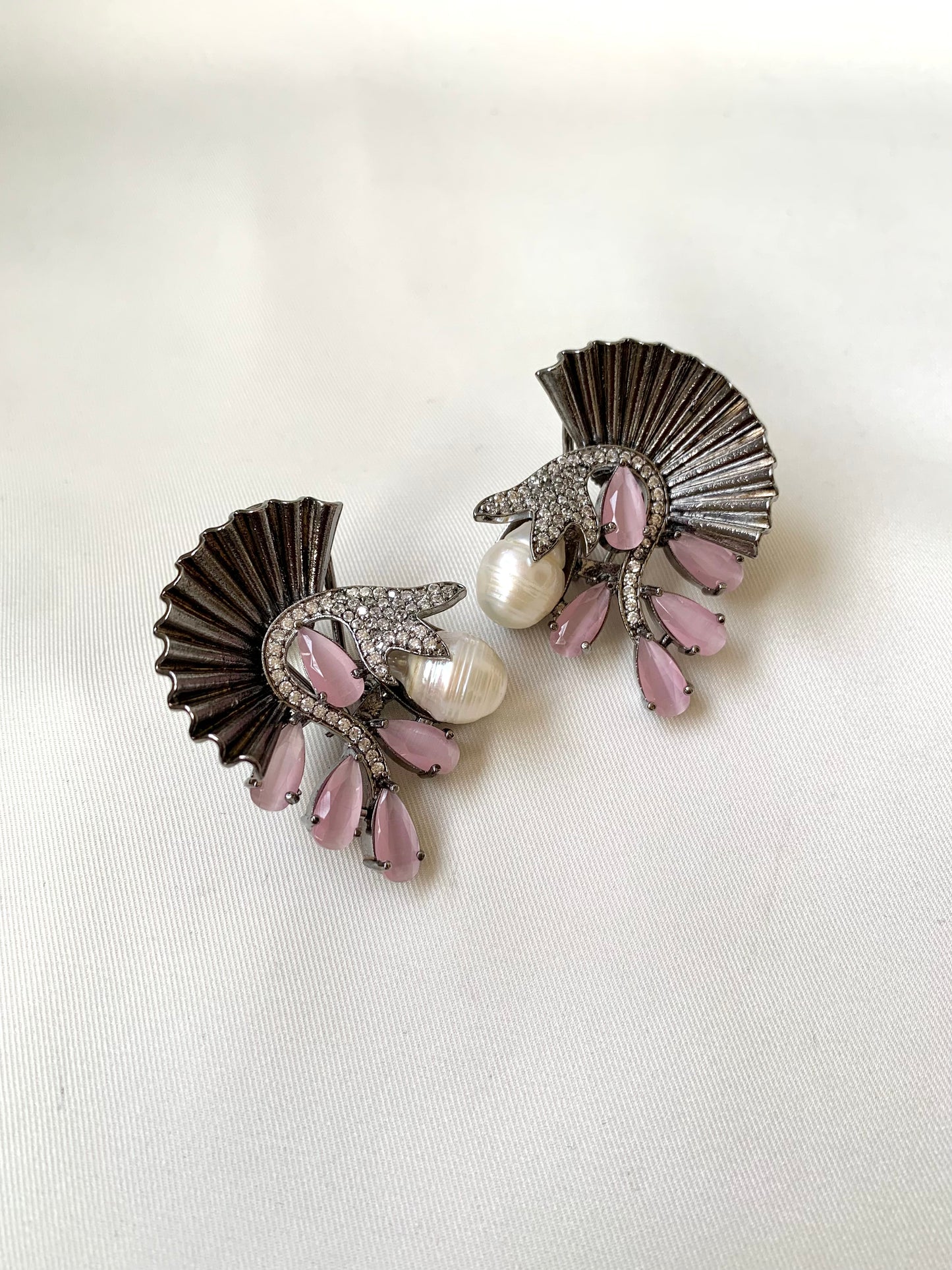 Ravaa pink designer earrings in rhodium plating with baroque pearls, American diamonds and semi-precious pink onyx