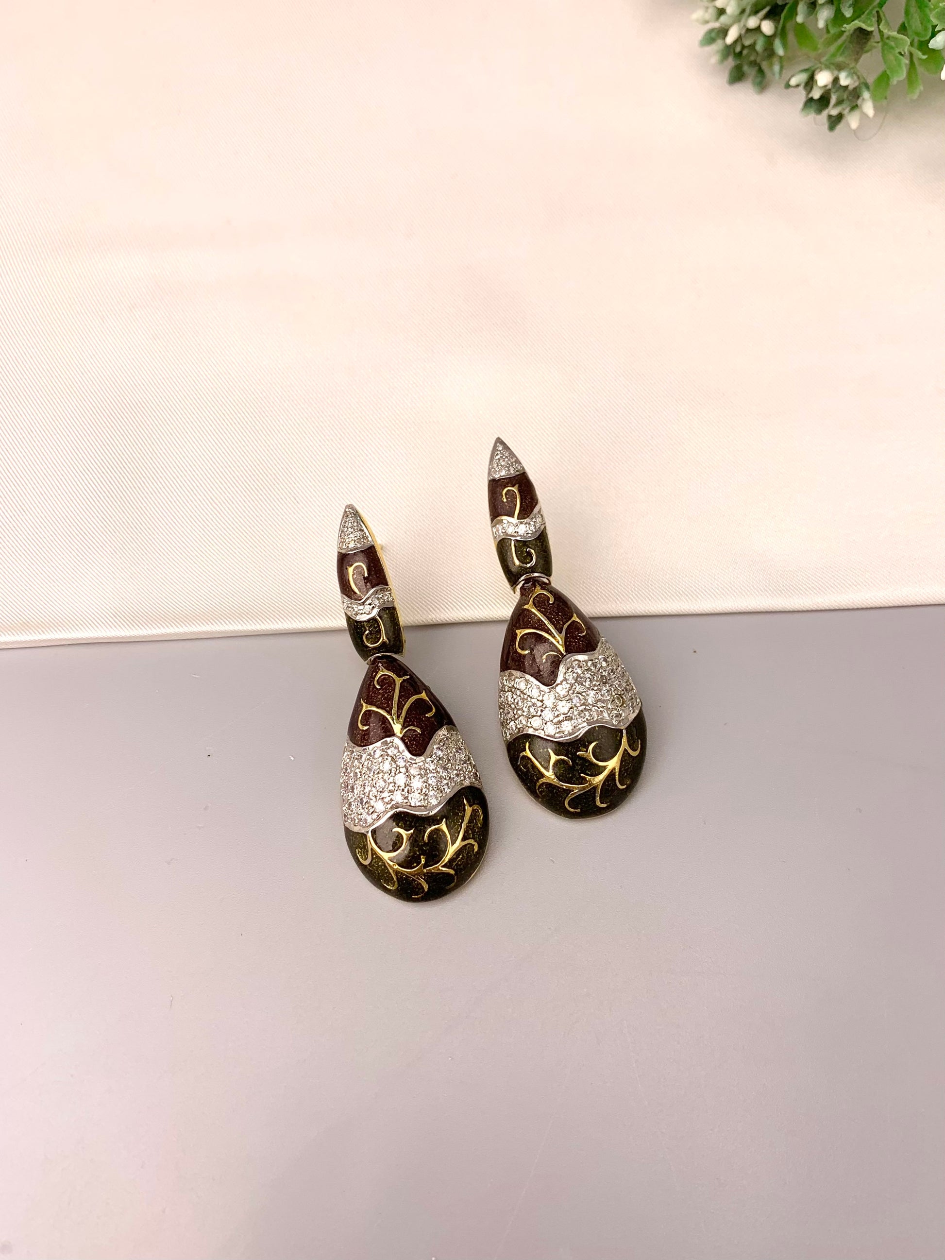Rayma handcrafted gold plated earrings with American diamonds and hand painted meena work
