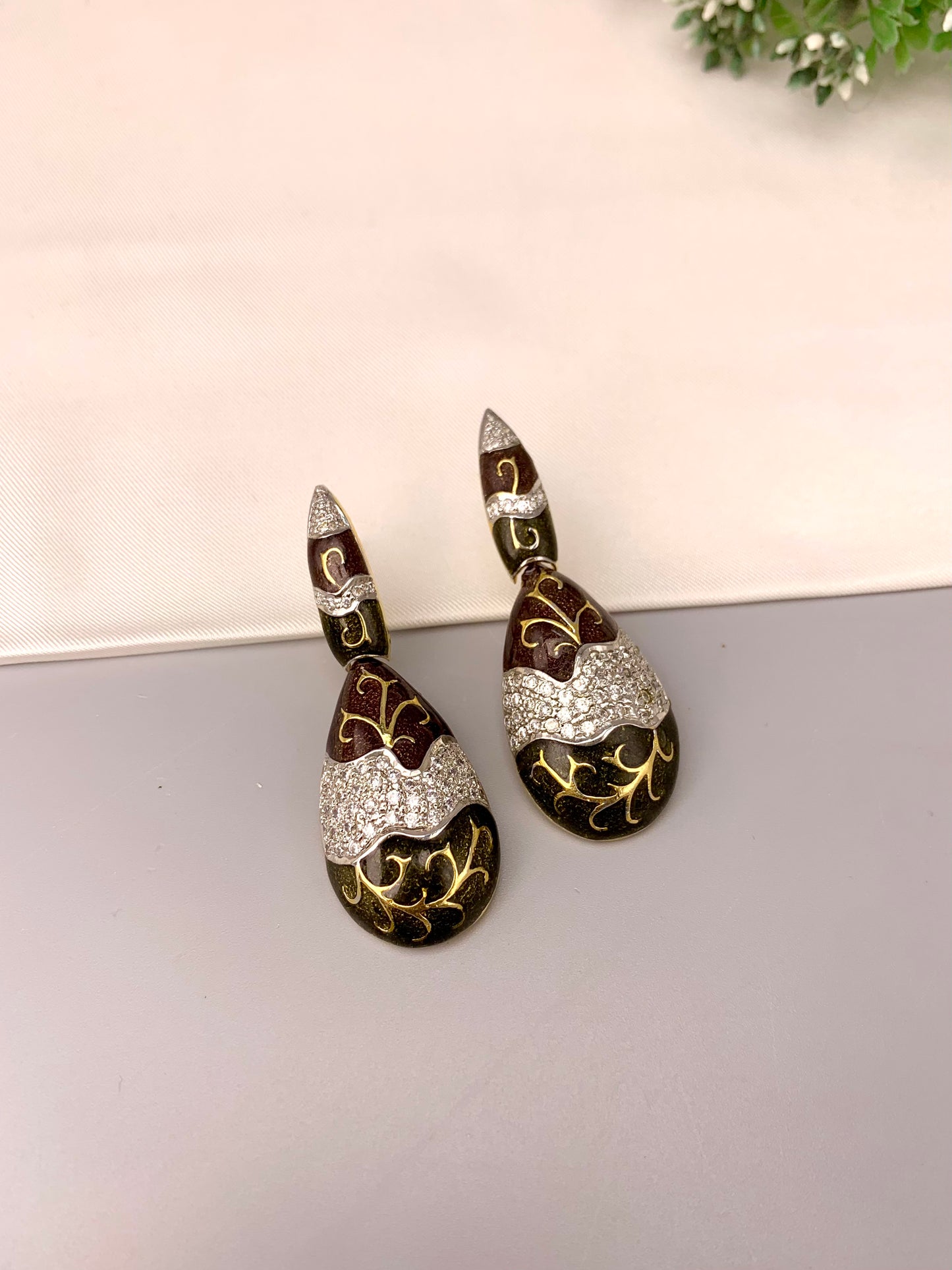 Rayma handcrafted gold plated earrings with American diamonds and hand painted meena work