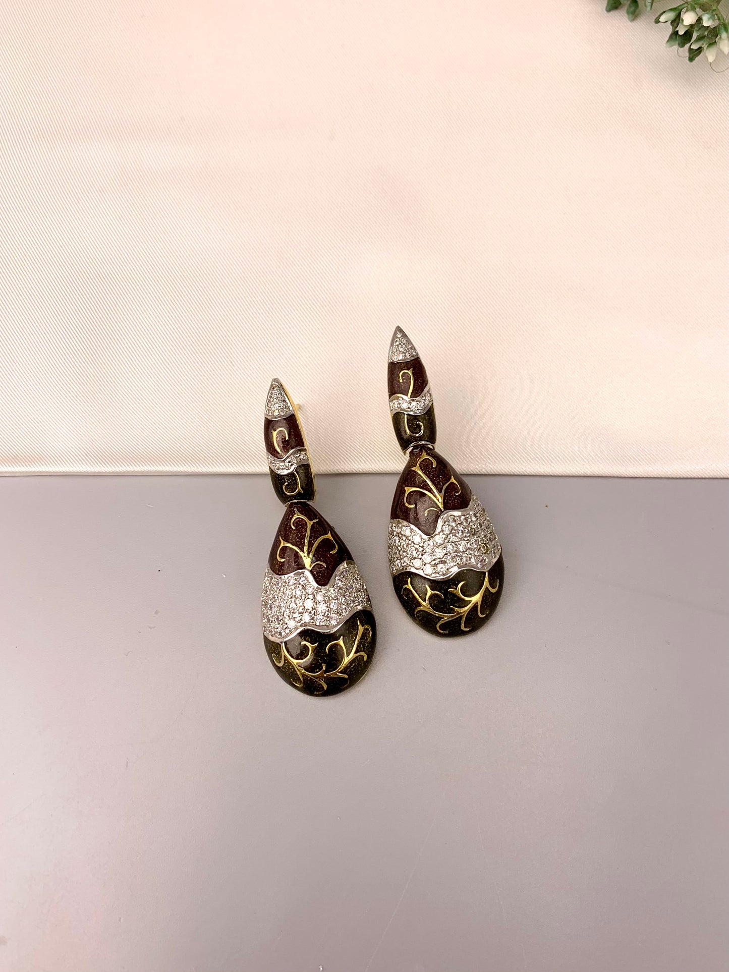 Rayma handcrafted gold plated earrings with American diamonds and hand painted meena work