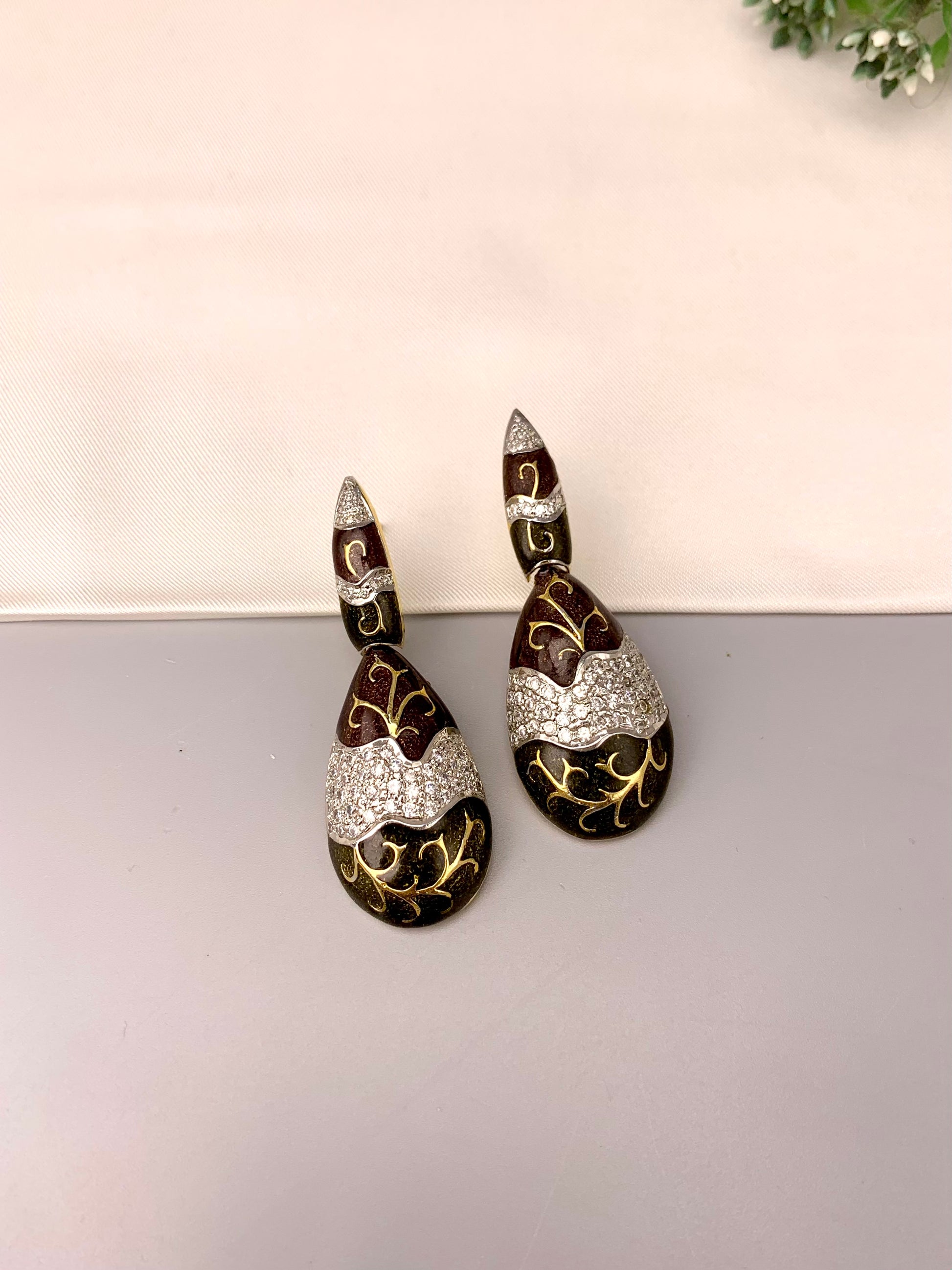 Rayma handcrafted gold plated earrings with American diamonds and hand painted meena work