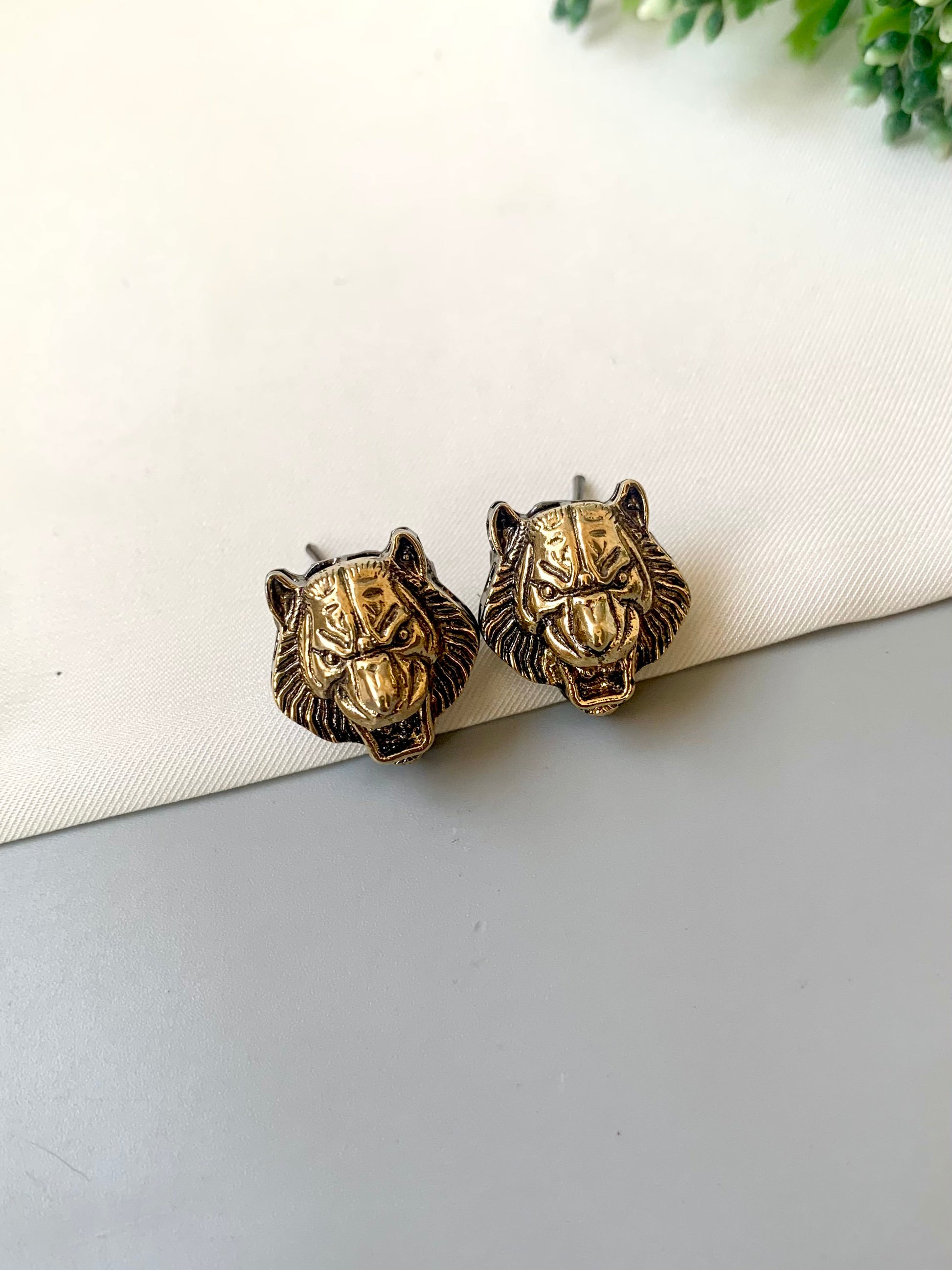 Designer-inspired Regal Roar Lion Studs in antique gold finish with detailed lion motif — Zamal Jewels