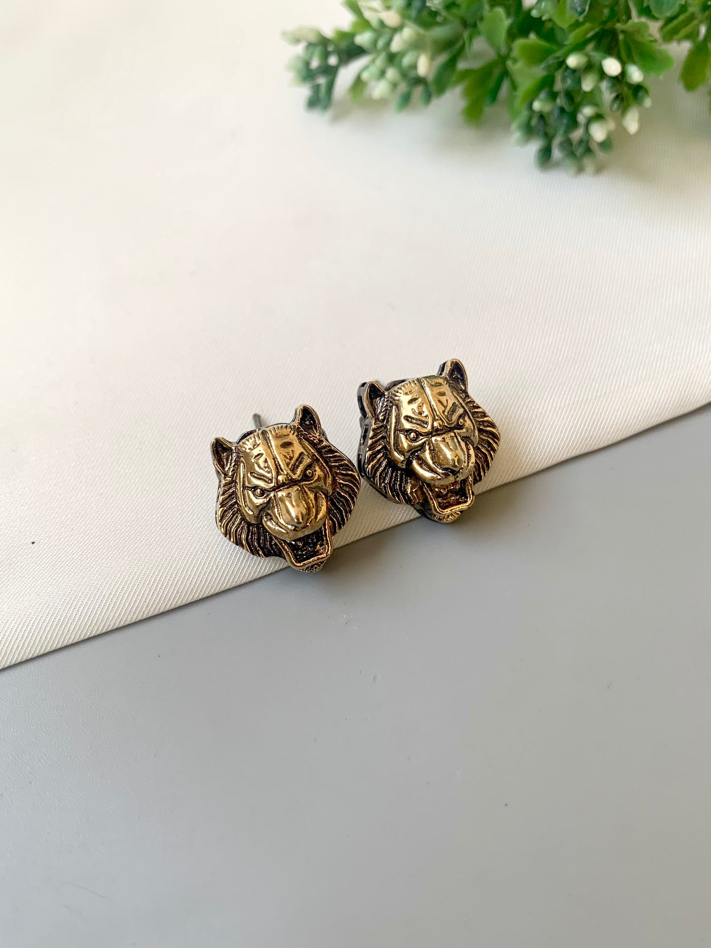 Designer-inspired Regal Roar Lion Studs in antique gold finish with detailed lion motif — Zamal Jewels