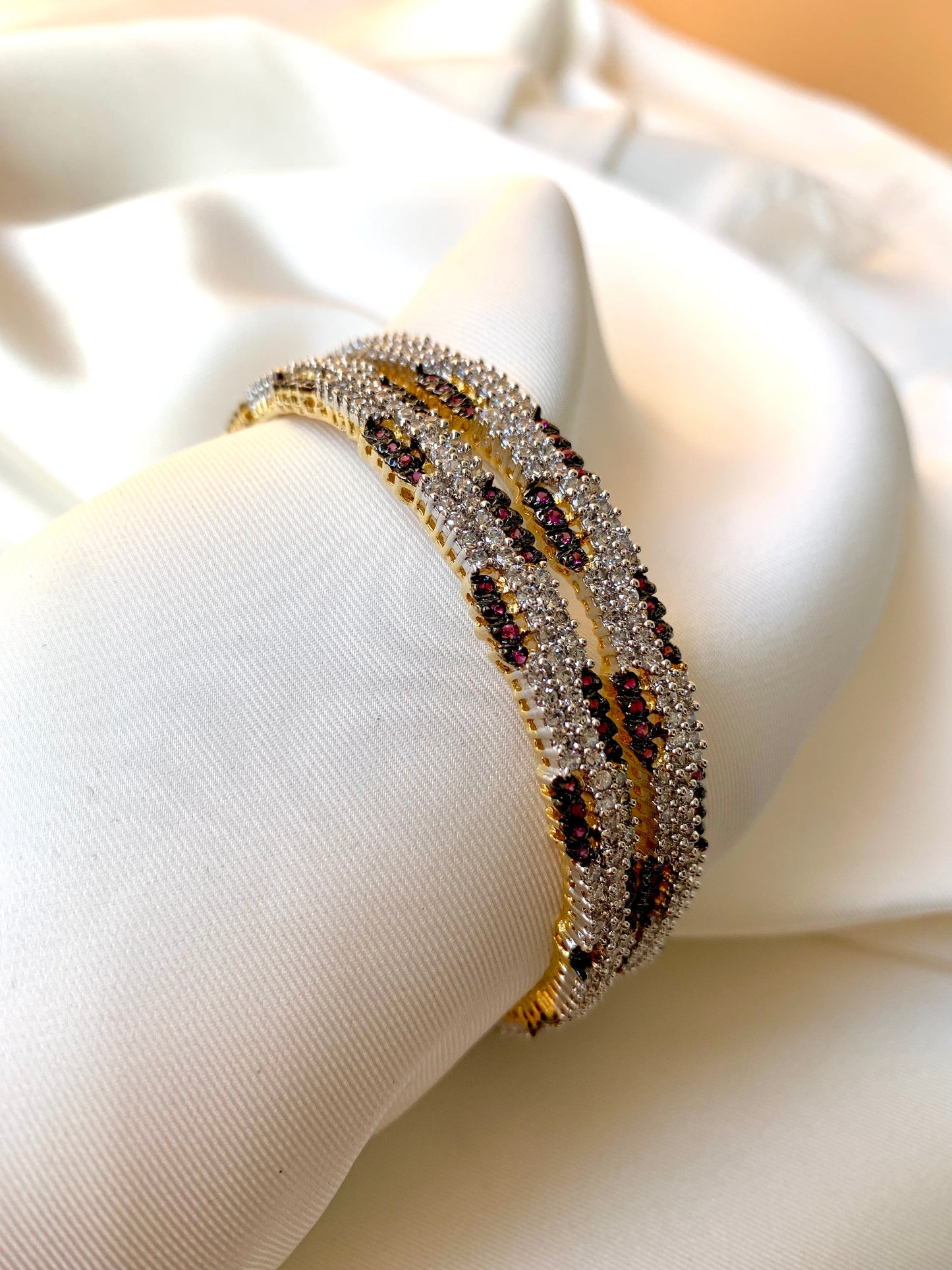 Riley handcrafted 22kt gold plated bangles with American Diamonds and semi-precious Rubies, sold as a pair
