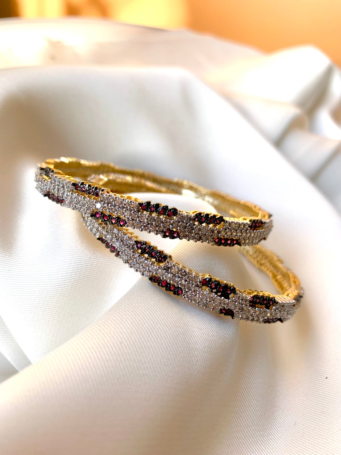 Riley handcrafted 22kt gold plated bangles with American Diamonds and semi-precious Rubies, sold as a pair