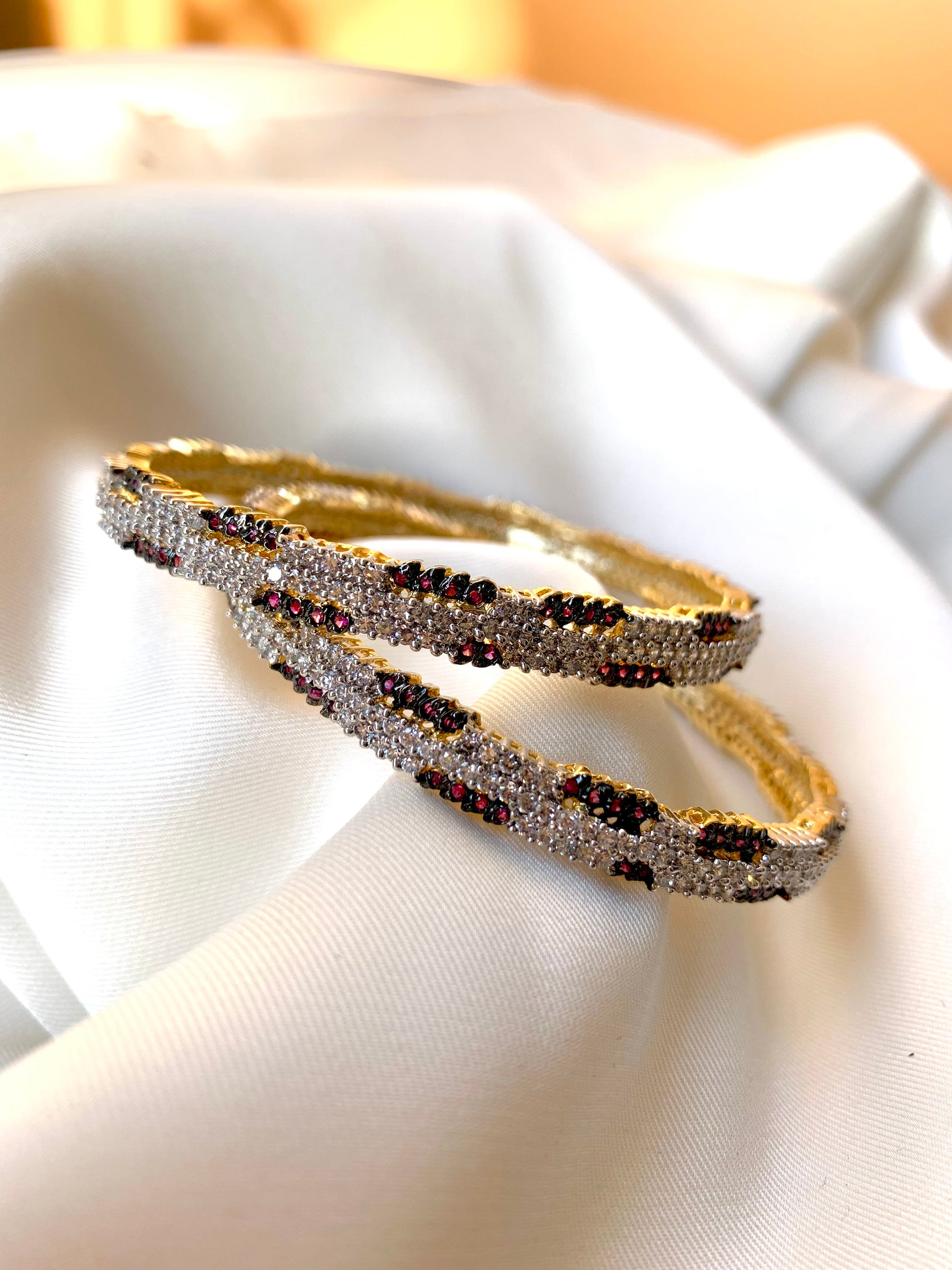 Riley handcrafted 22kt gold plated bangles with American Diamonds and semi-precious Rubies, sold as a pair