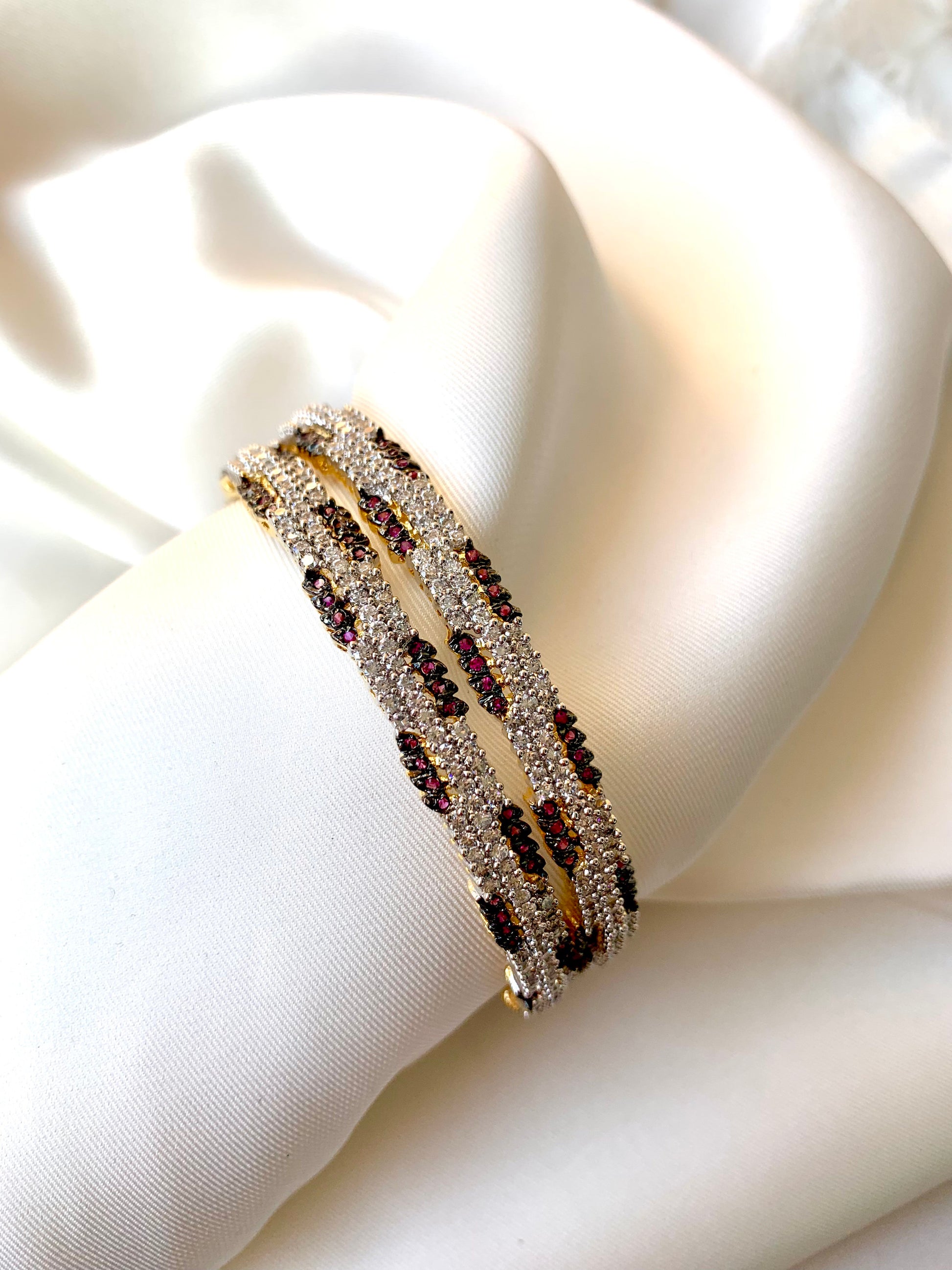 Riley handcrafted 22kt gold plated bangles with American Diamonds and semi-precious Rubies, sold as a pair