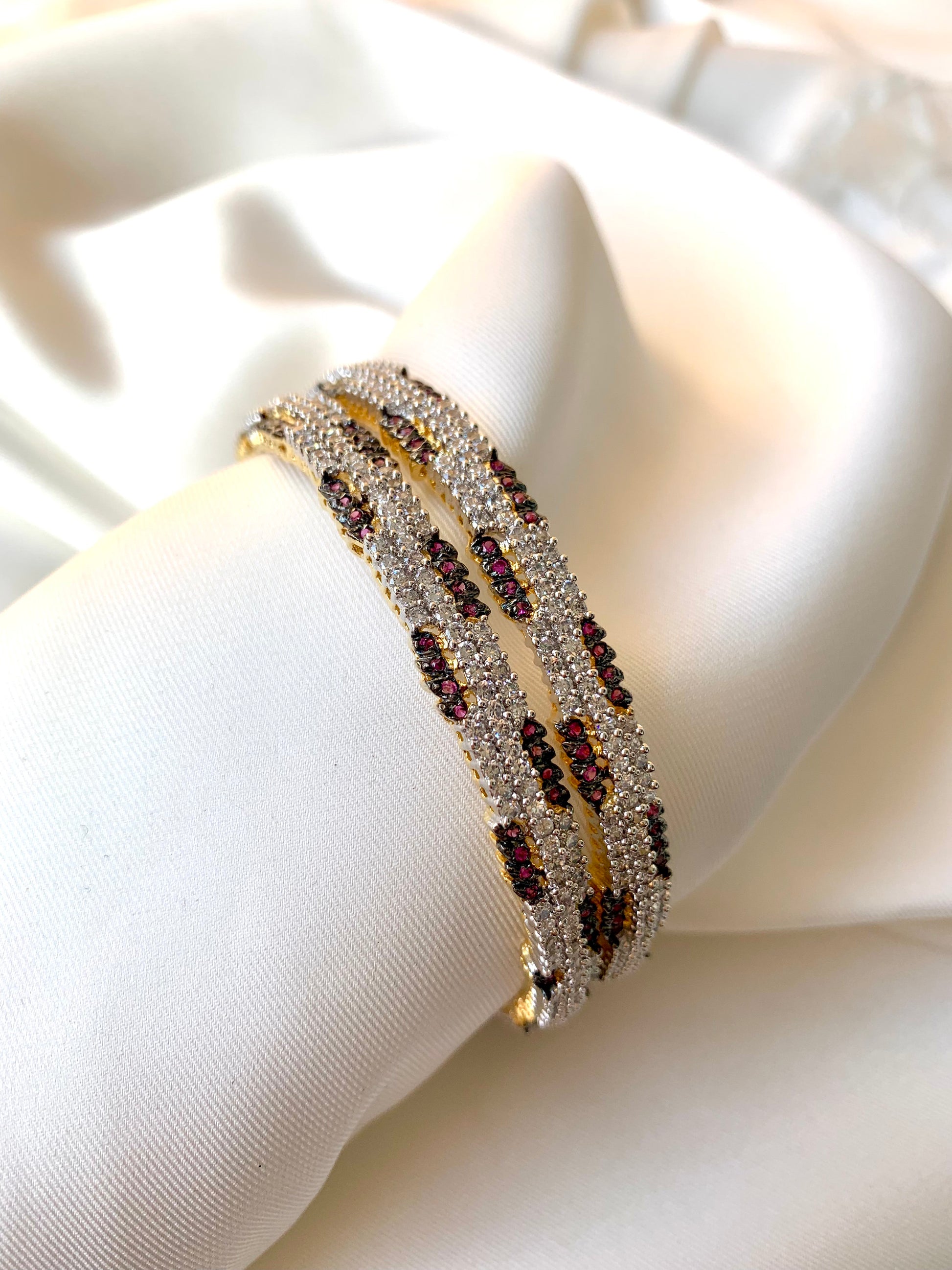 Riley handcrafted 22kt gold plated bangles with American Diamonds and semi-precious Rubies, sold as a pair