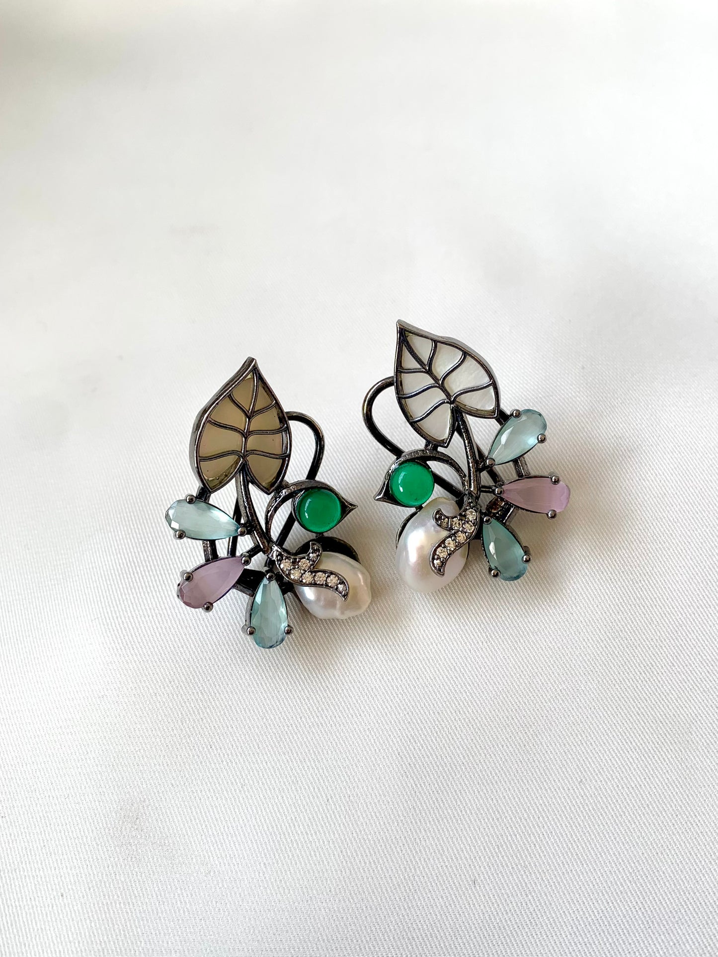 Riwaaz handcrafted rhodium plated designer studs with baroque pearls, mother of pearl and onyx