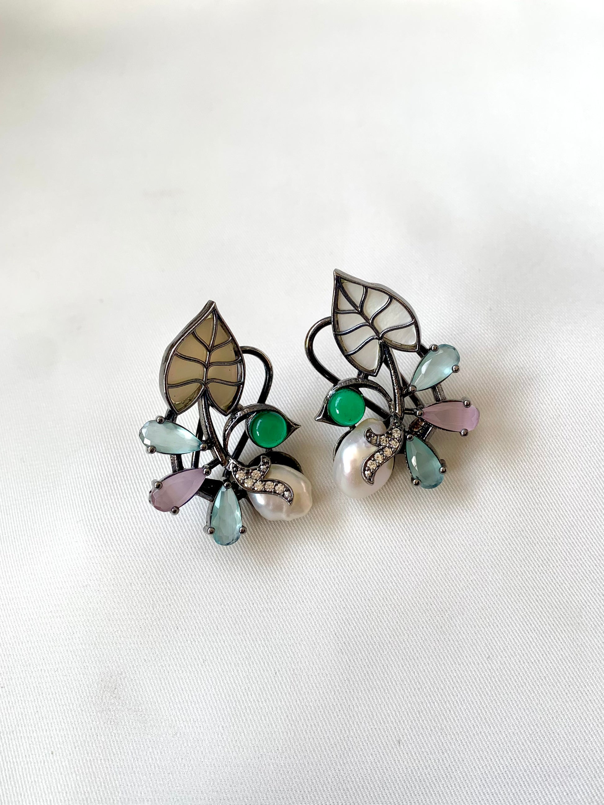 Riwaaz handcrafted rhodium plated designer studs with baroque pearls, mother of pearl and onyx