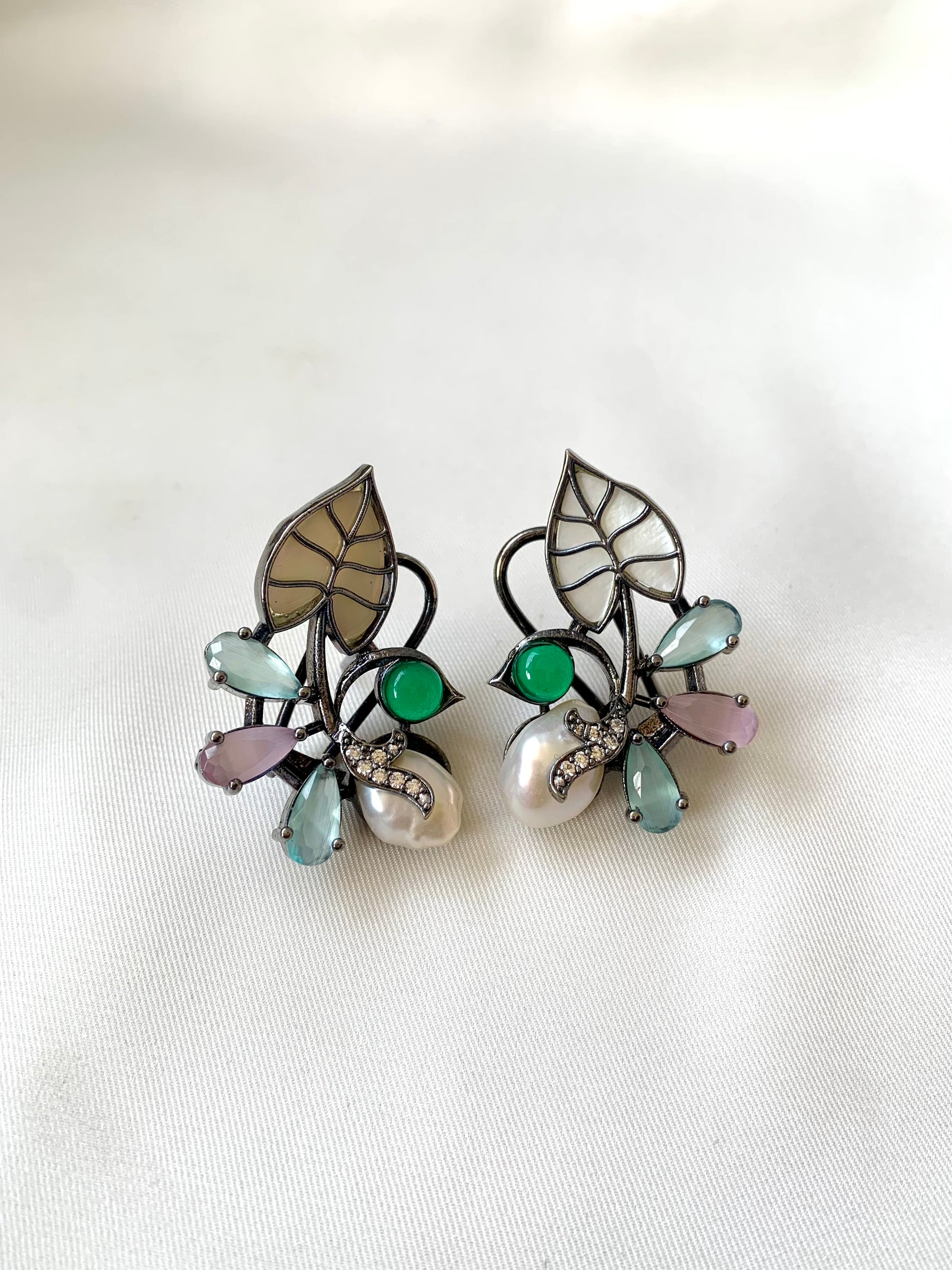 Riwaaz handcrafted rhodium plated designer studs with baroque pearls, mother of pearl and onyx