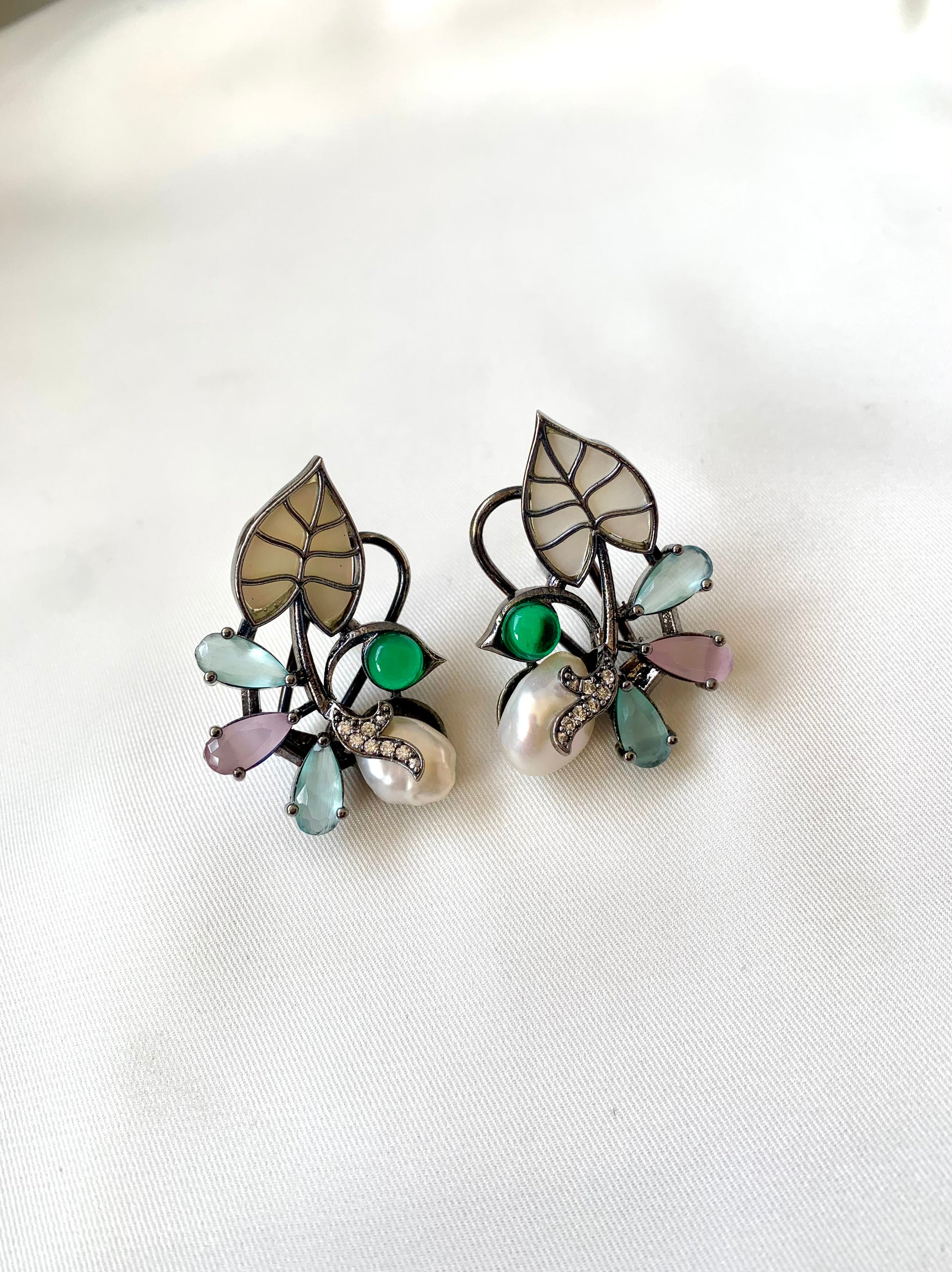 Riwaaz handcrafted rhodium plated designer studs with baroque pearls, mother of pearl and onyx