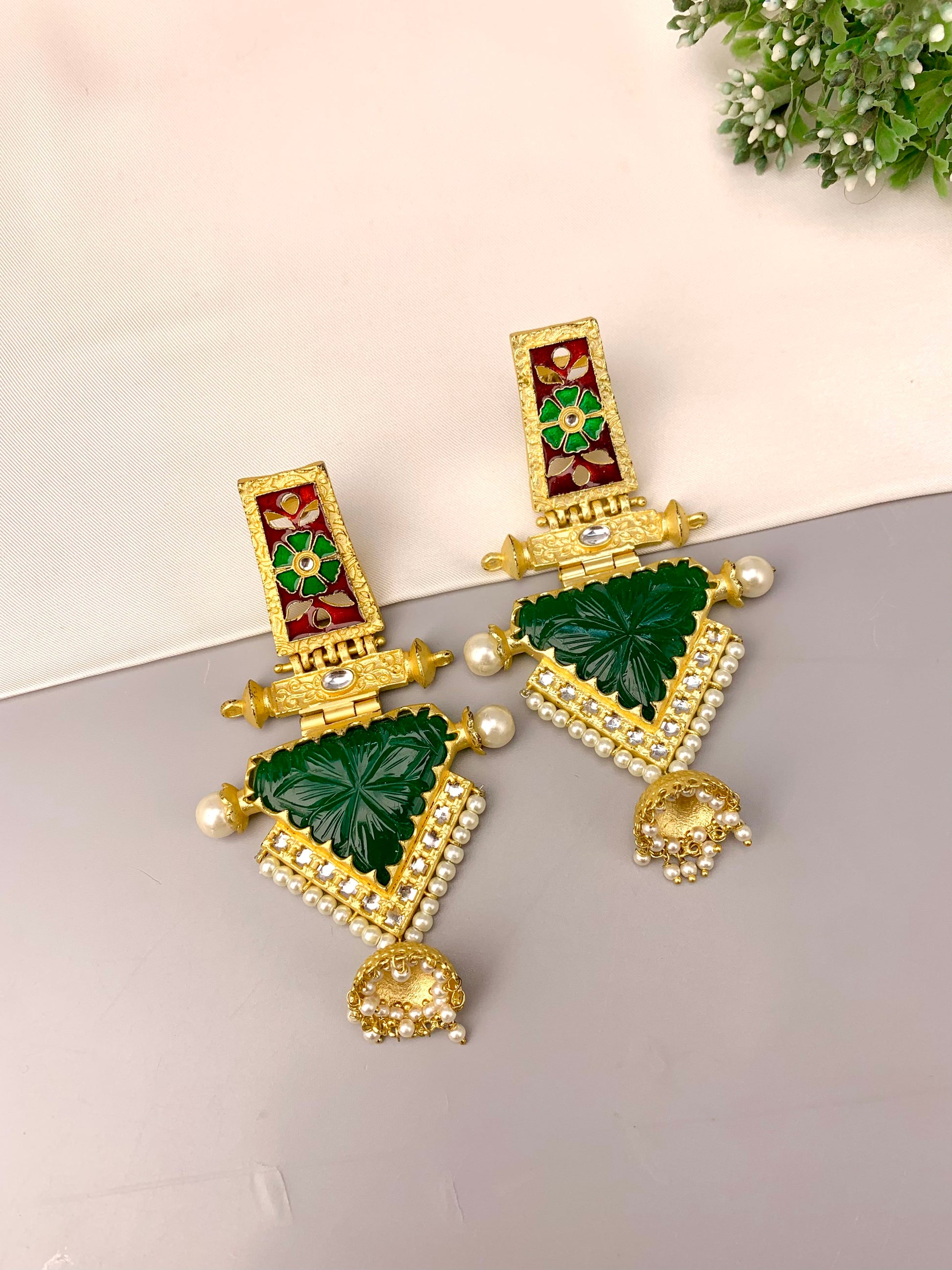 Roniya handcrafted jhumkas in 22kt gold plating with hand carved emerald polki kundan pearls and meena work