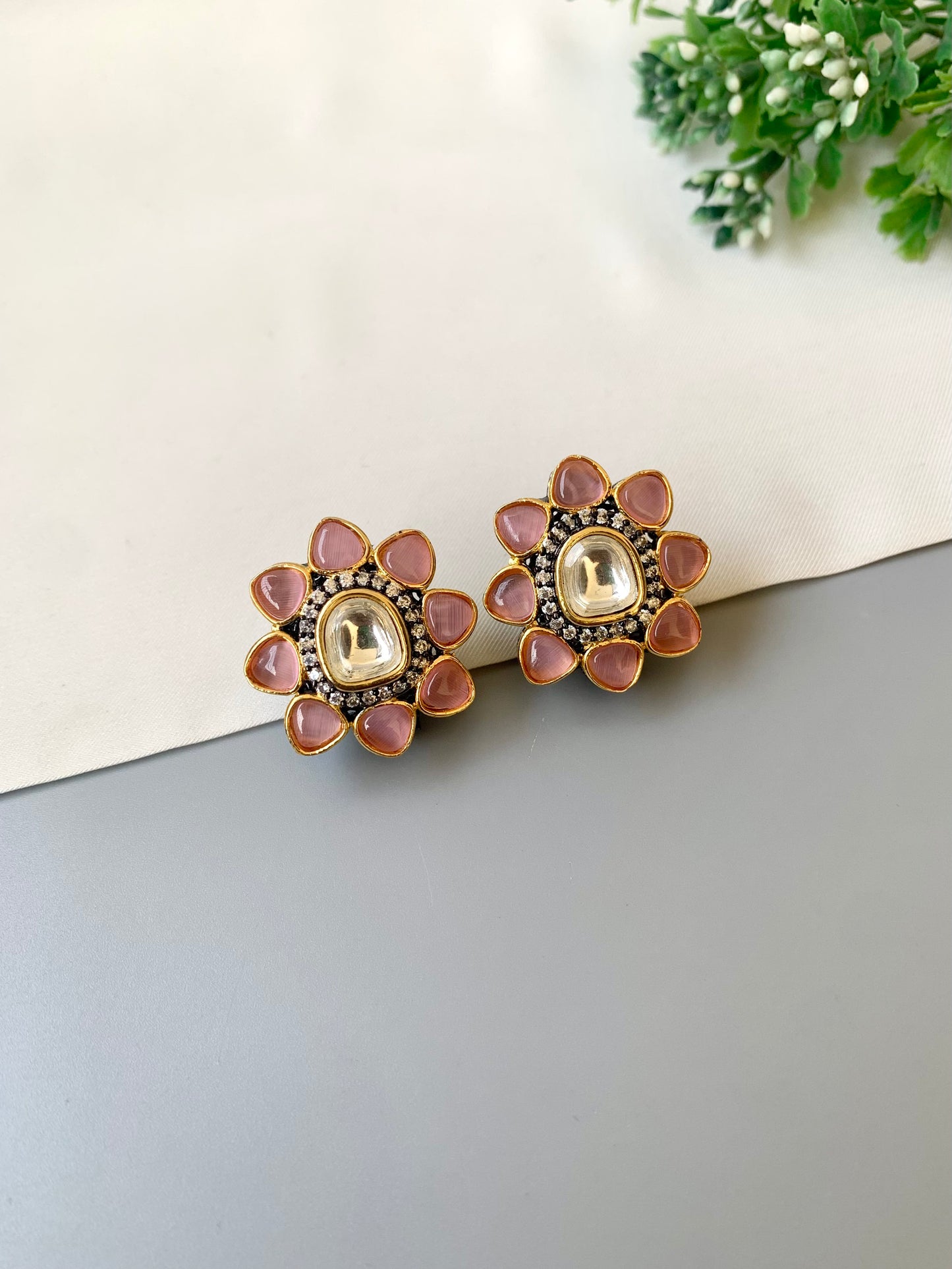 Hand crafted Sable Studs in rhodium plating with oxidized polish, featuring American Diamonds, Polki Kundan and semi-precious Onyx stones