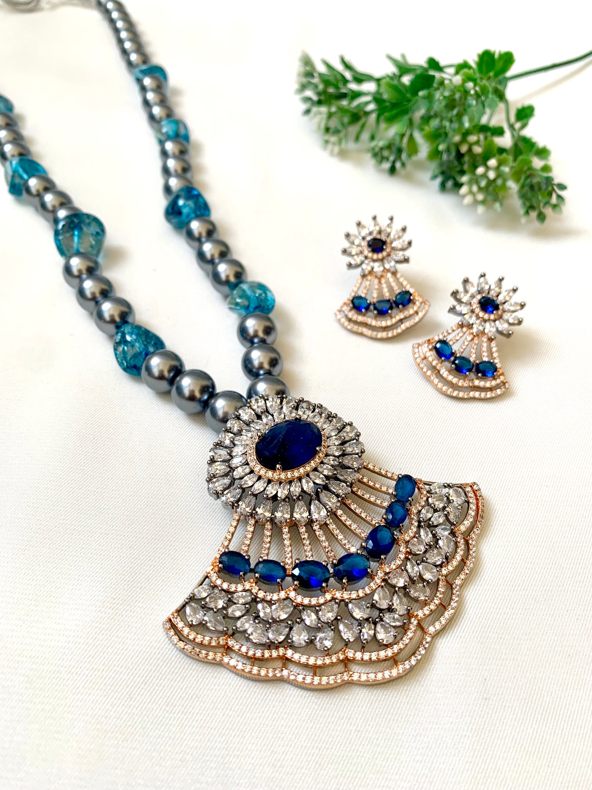 Saera sapphire maala set in black rose gold plating with American diamonds and pearls