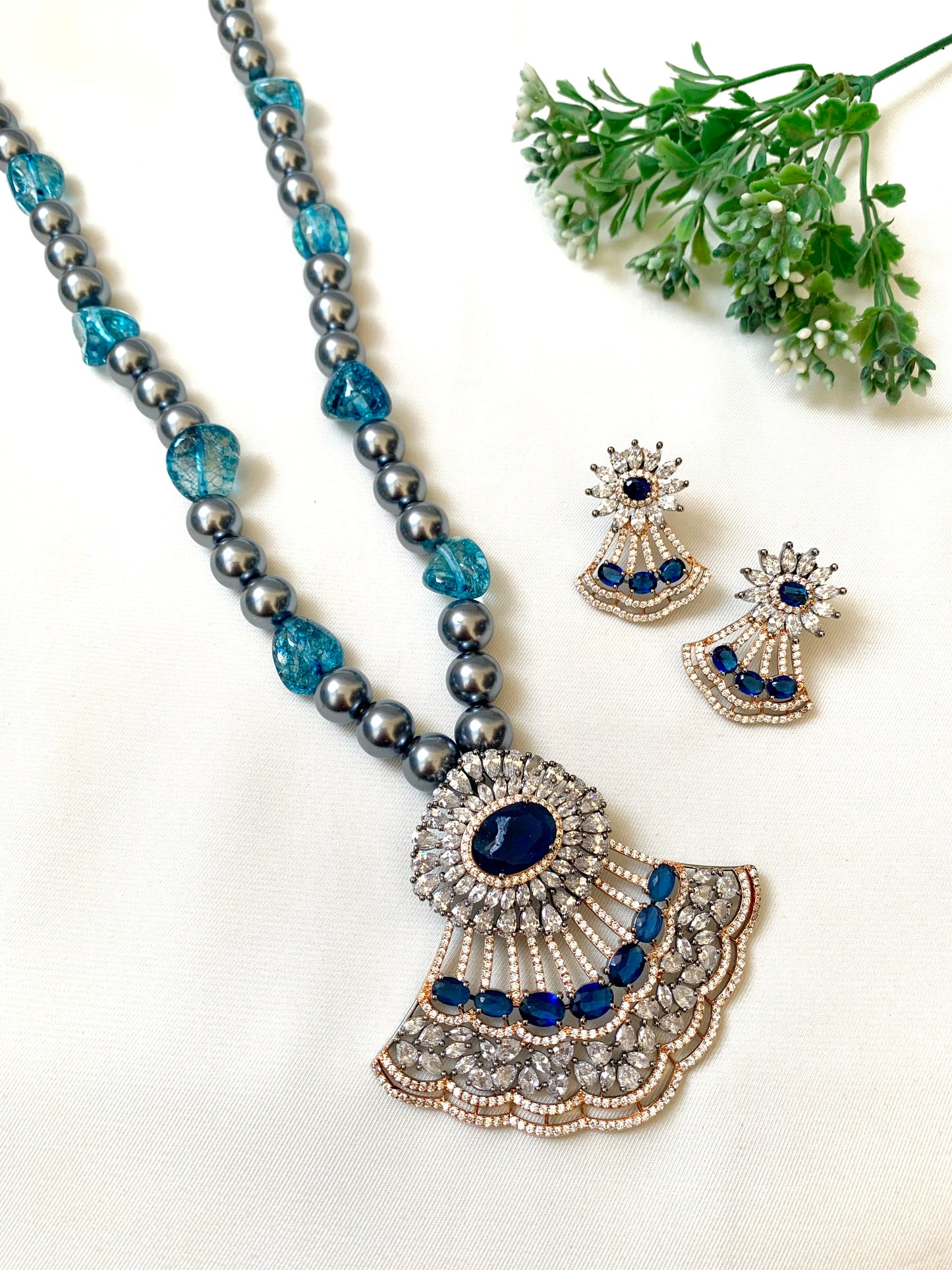 Saera sapphire maala set in black rose gold plating with American diamonds and pearls