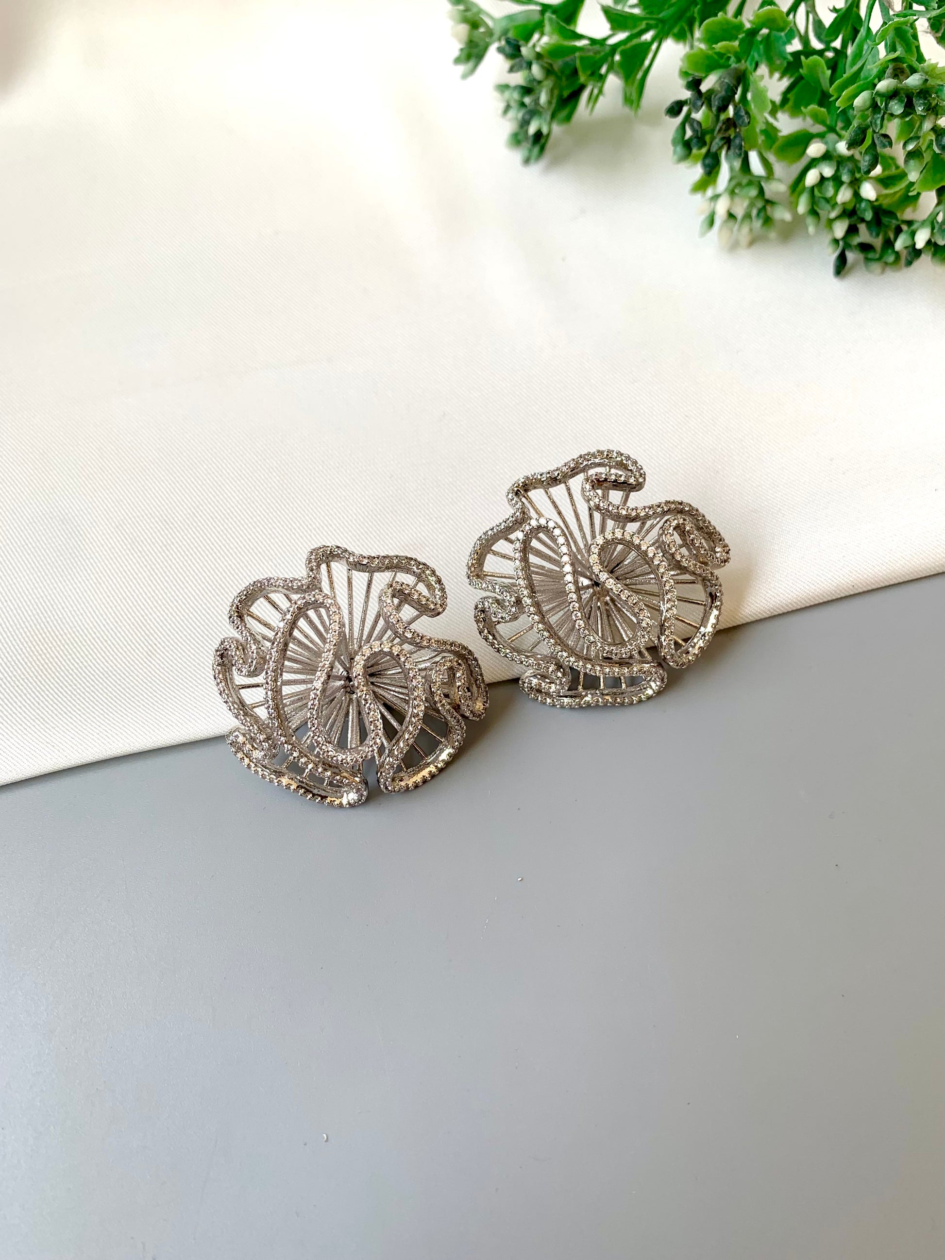 Safina rhodium plated platinum finish studs with American diamonds