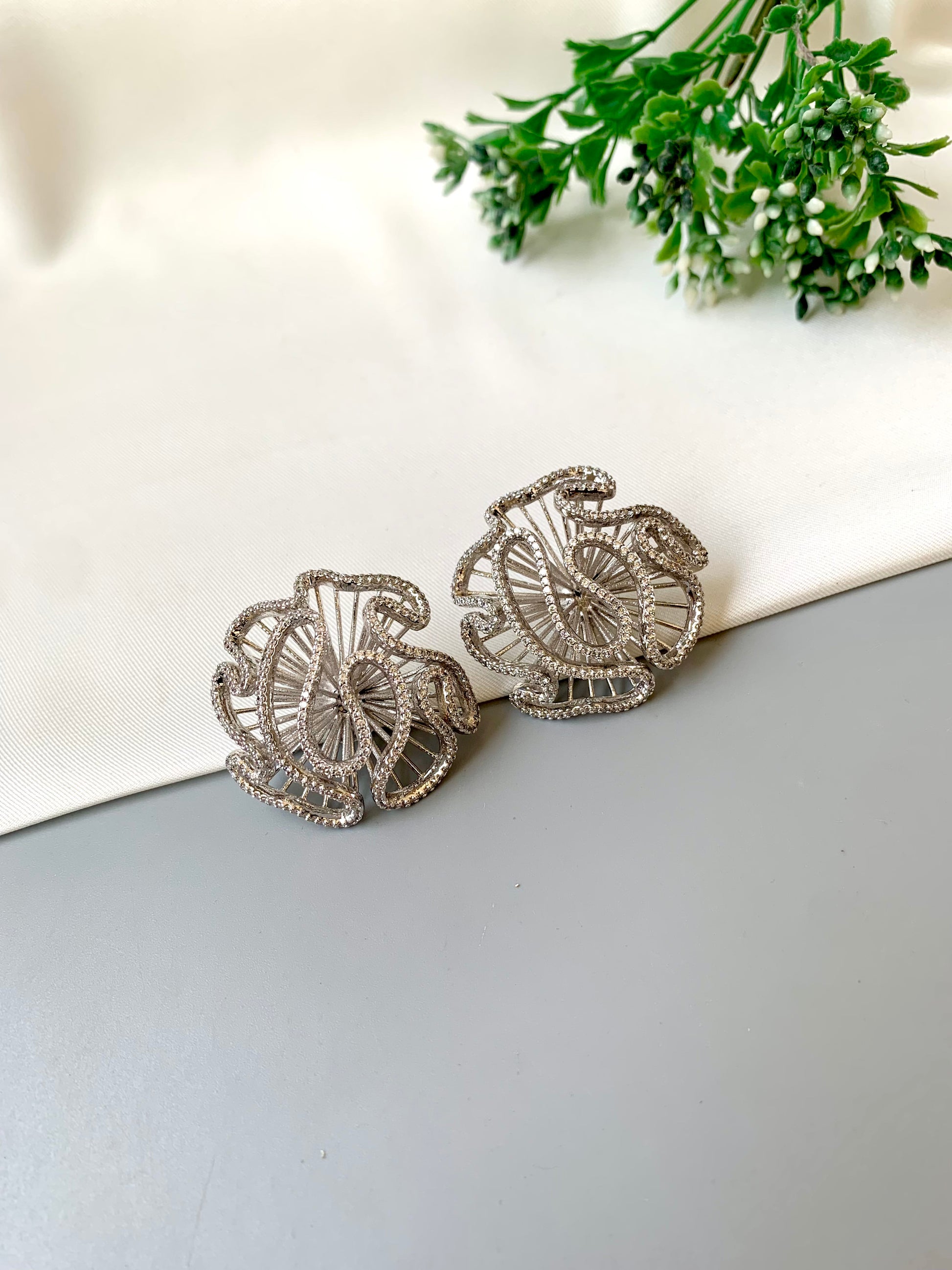 Safina rhodium plated platinum finish studs with American diamonds