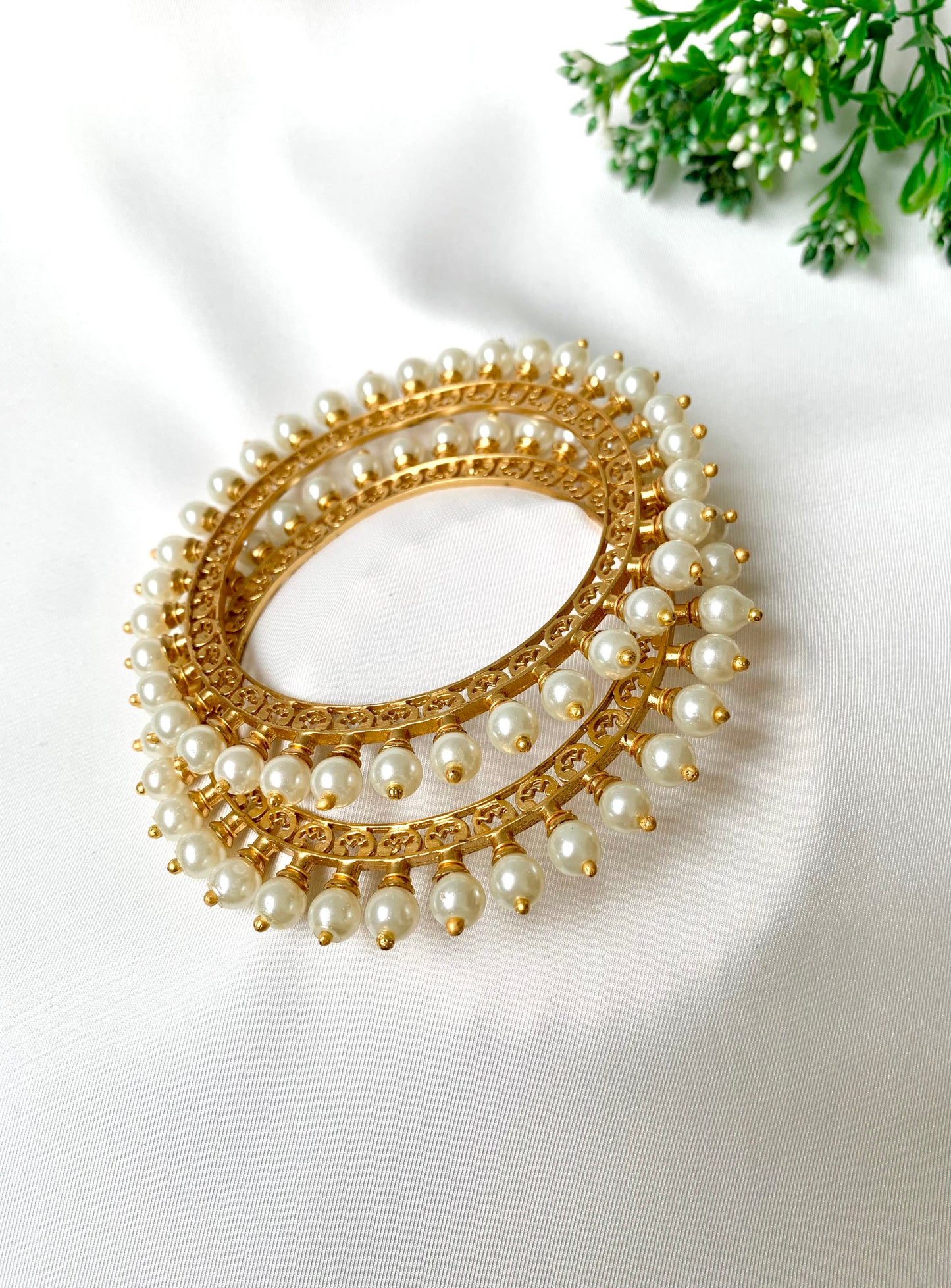 Pair of handcrafted 22kt gold plated bangles with hand filigree work and semi-precious pearls, size 2.6