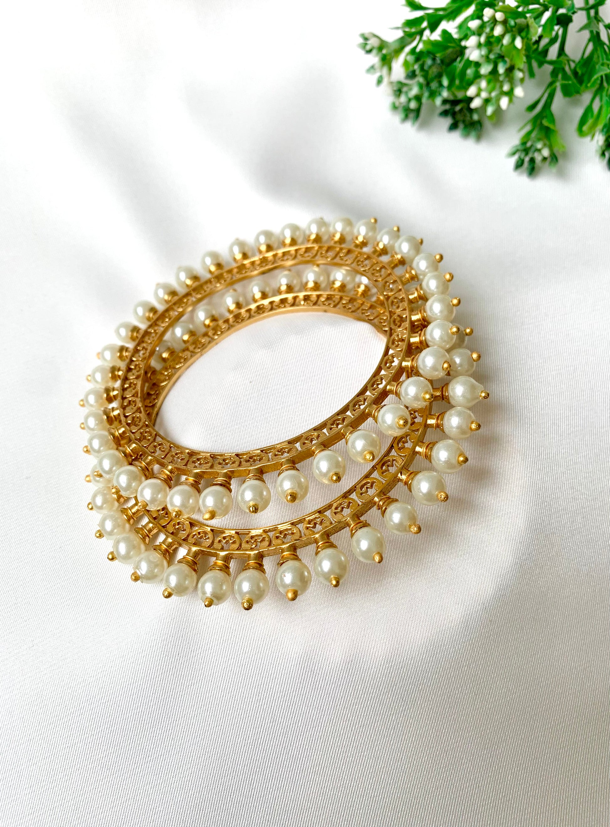 Pair of handcrafted 22kt gold plated bangles with hand filigree work and semi-precious pearls, size 2.6
