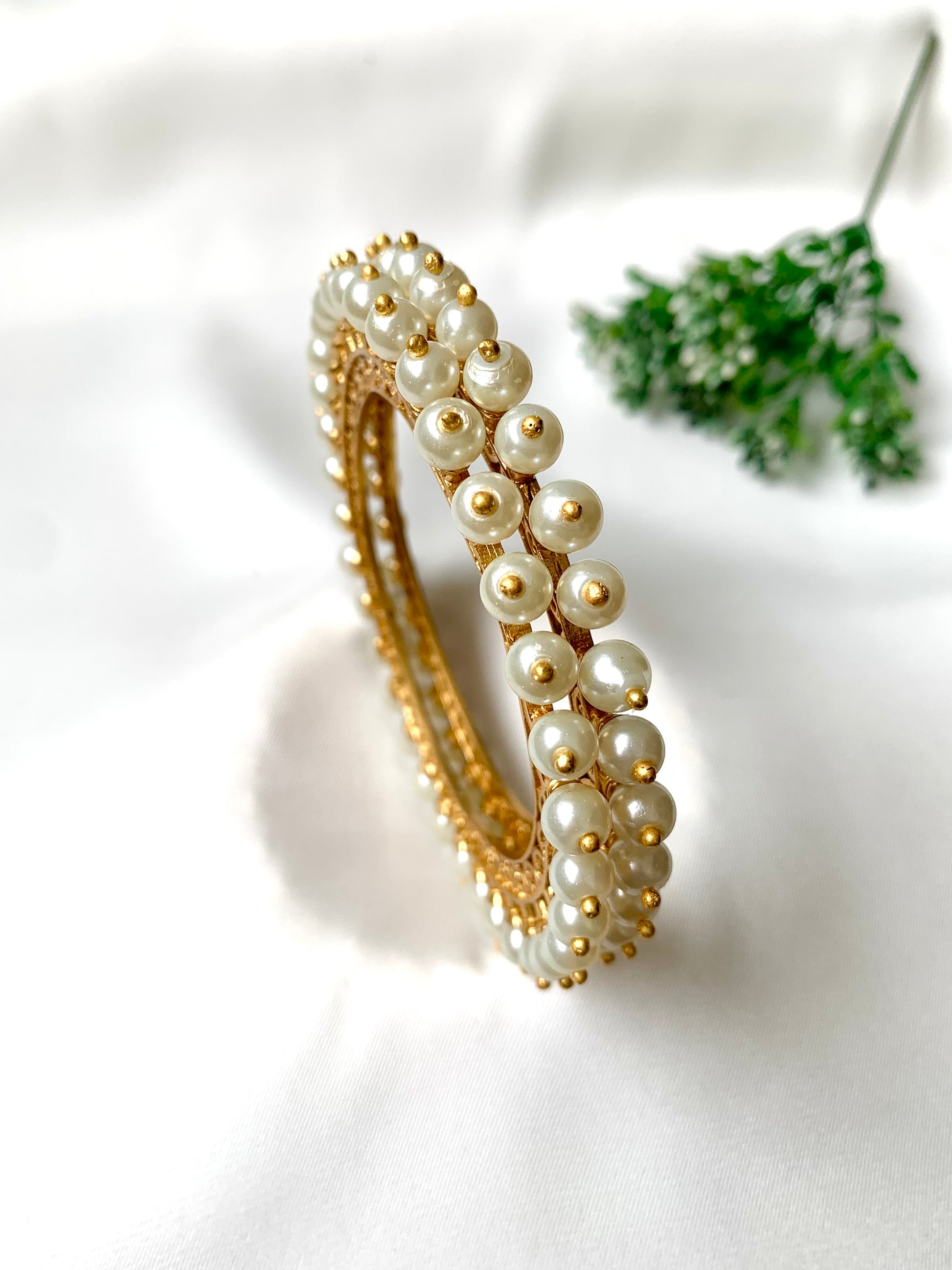 Pair of handcrafted 22kt gold plated bangles with hand filigree work and semi-precious pearls, size 2.6
