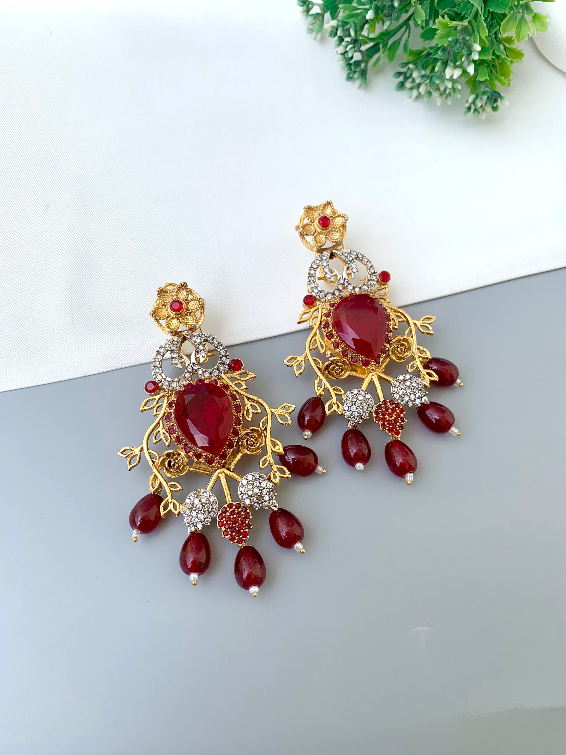 Sakeena ruby earrings in 22kt gold plating with American diamonds