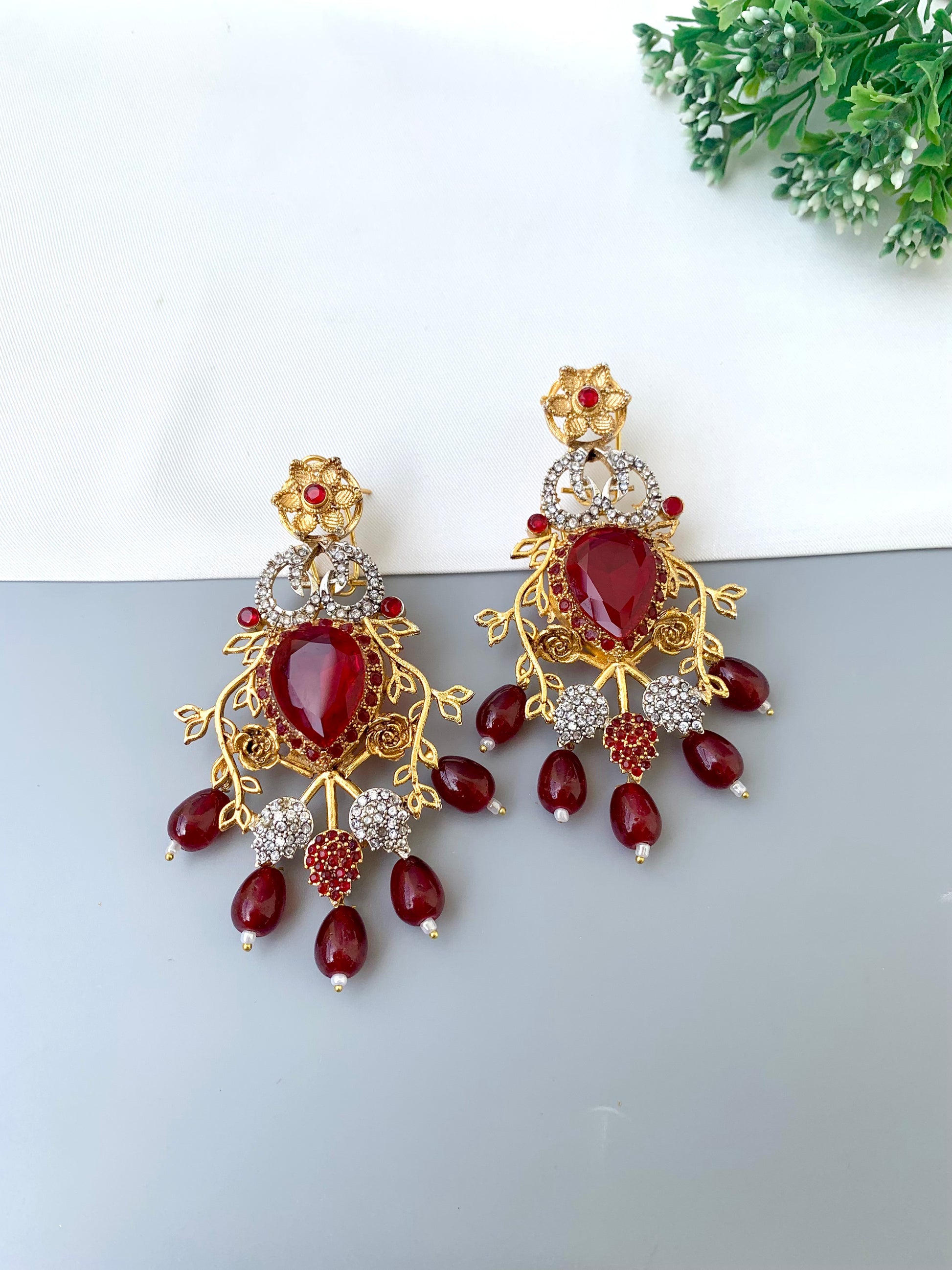 Sakeena ruby earrings in 22kt gold plating with American diamonds