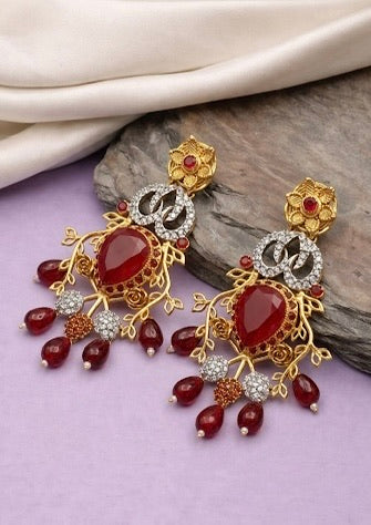 Sakeena ruby earrings in 22kt gold plating with American diamonds
