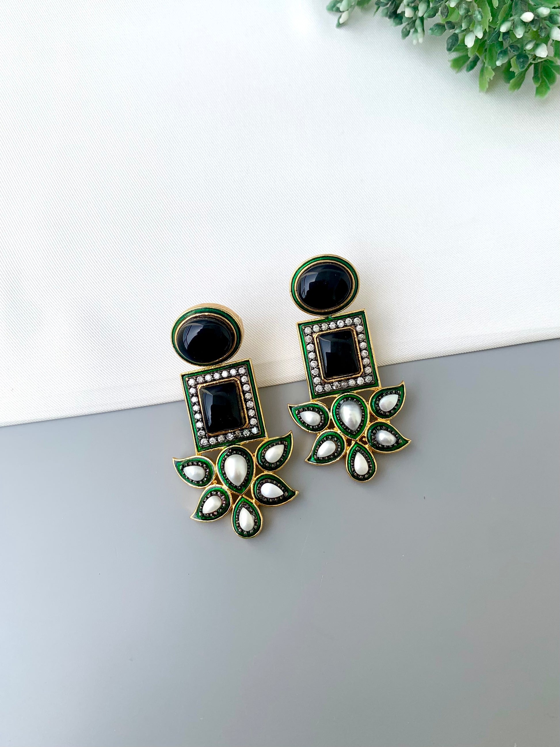Sanah rhodium plated oxidized earrings with onyx pearls American diamonds and hand painted meena