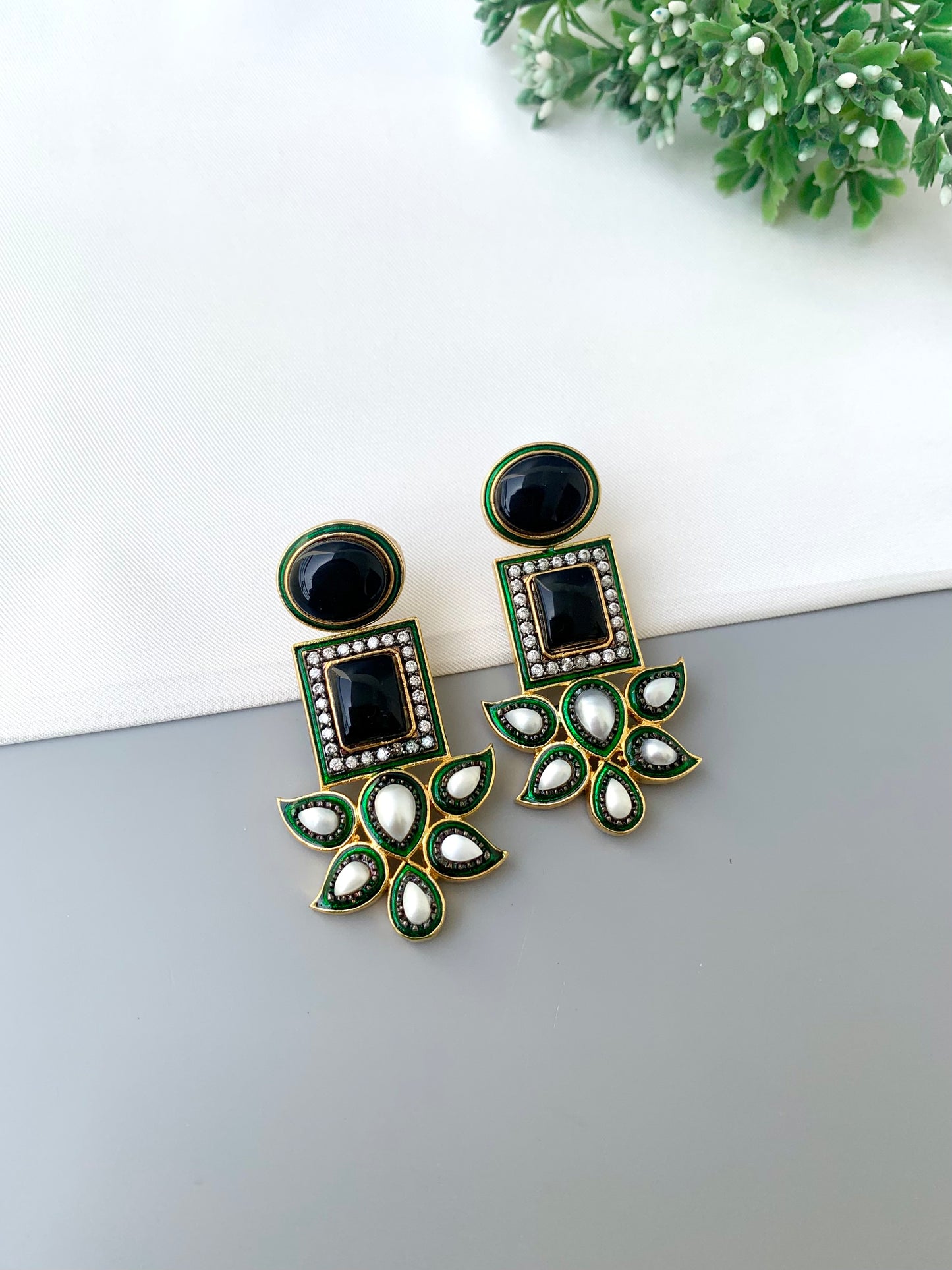 Sanah rhodium plated oxidized earrings with onyx pearls American diamonds and hand painted meena