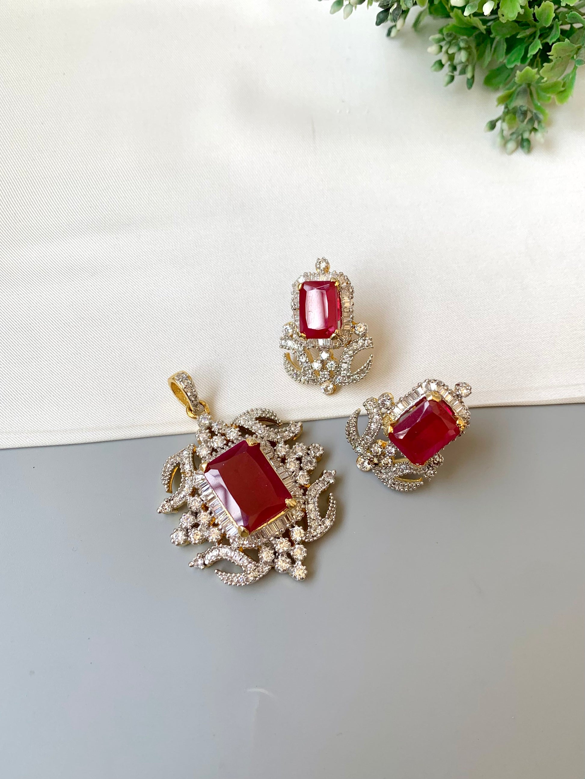 Savya ruby pendant set in 22kt gold plating with american diamonds and semi precious ruby