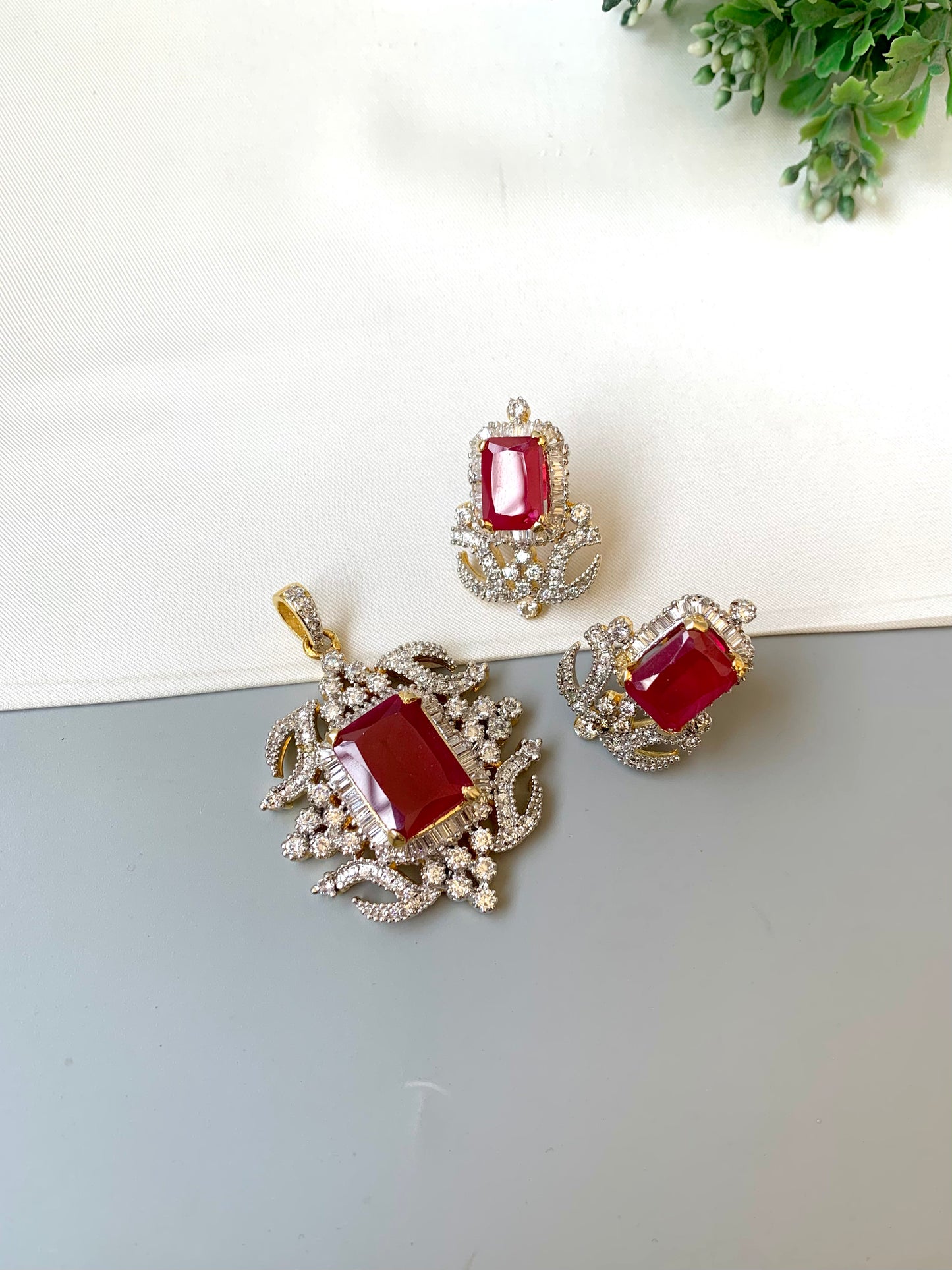 Savya ruby pendant set in 22kt gold plating with american diamonds and semi precious ruby