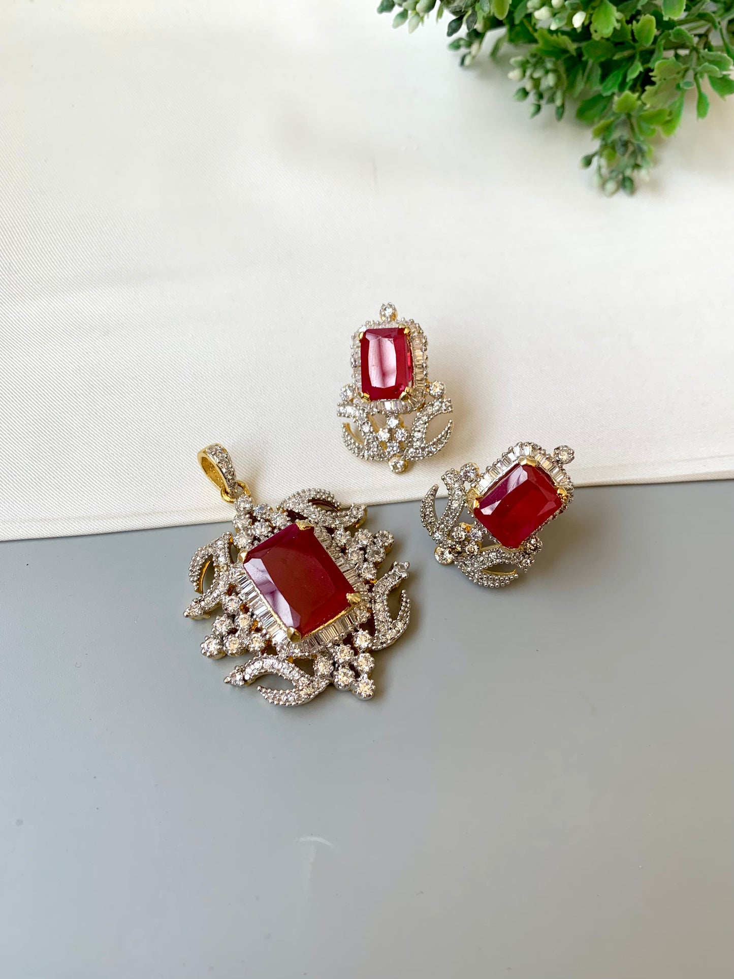 Savya ruby pendant set in 22kt gold plating with american diamonds and semi precious ruby