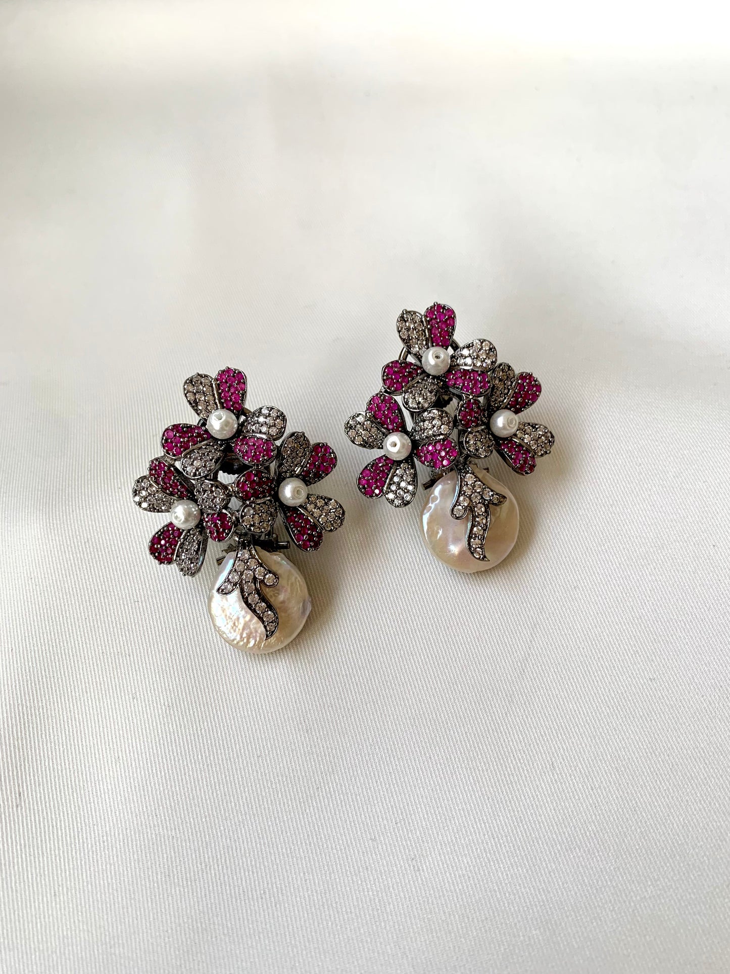 Sayyah handcrafted rhodium oxidized signature earrings with baroque pearls and ruby Swarovski crystals