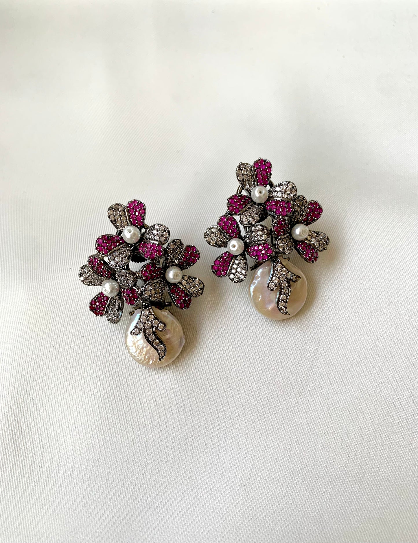Sayyah handcrafted rhodium oxidized signature earrings with baroque pearls and ruby Swarovski crystals