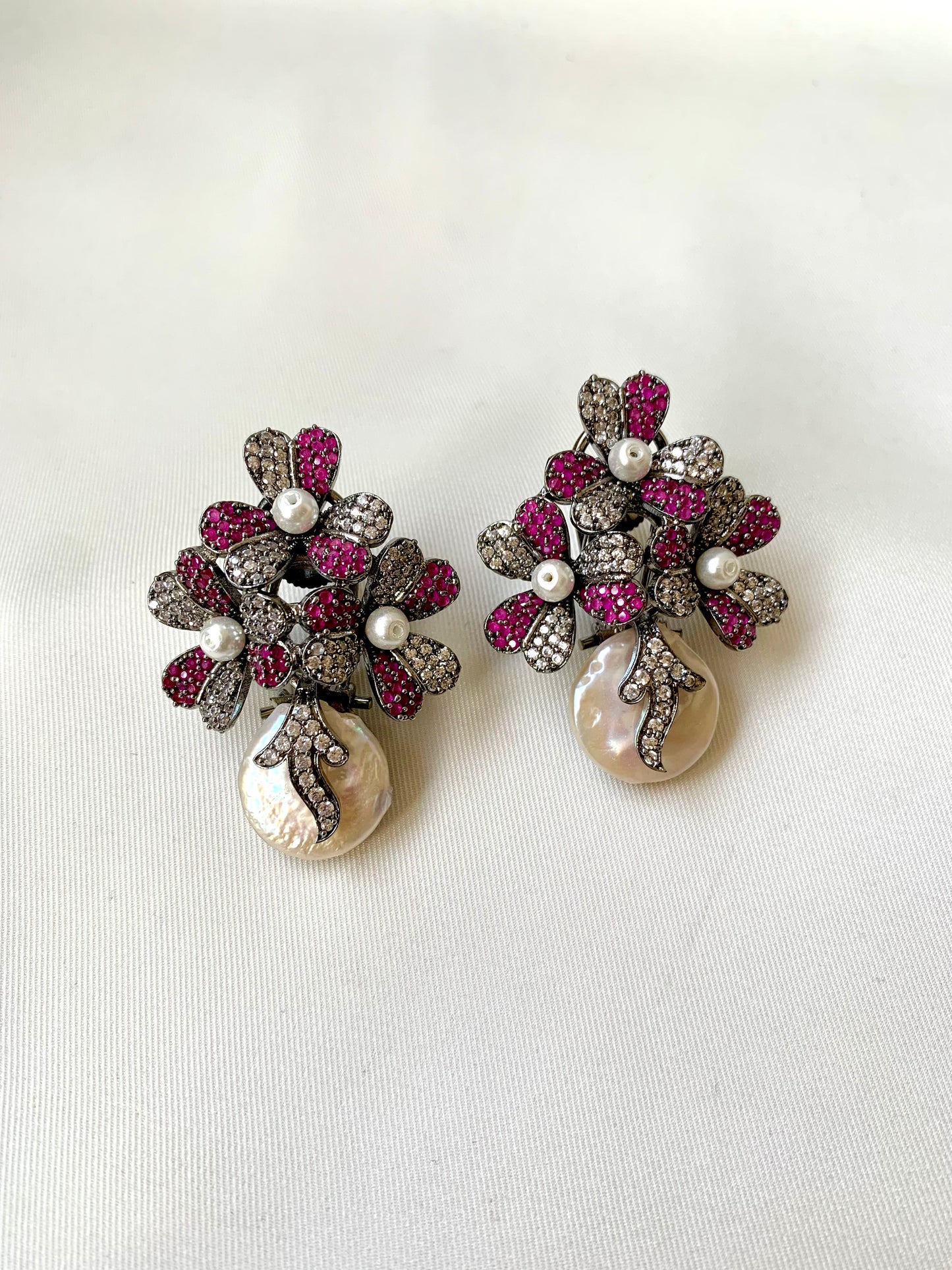 Sayyah handcrafted rhodium oxidized signature earrings with baroque pearls and ruby Swarovski crystals