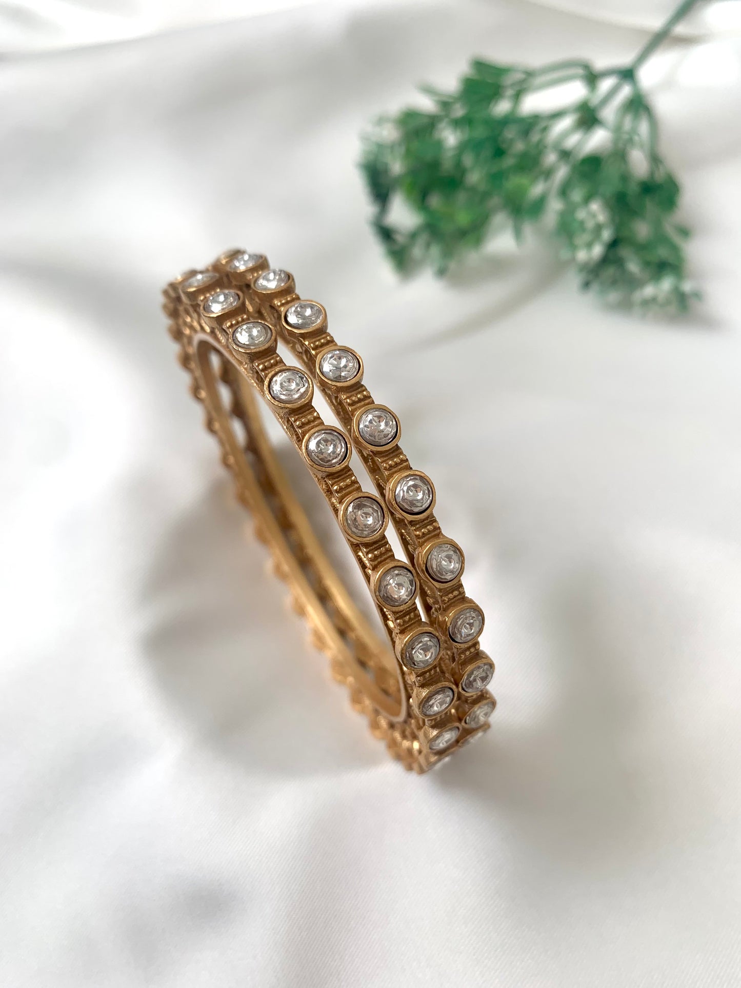 Serene handcrafted 22kt matte gold plated bangles with high quality Polki Kundan, sold as a pair