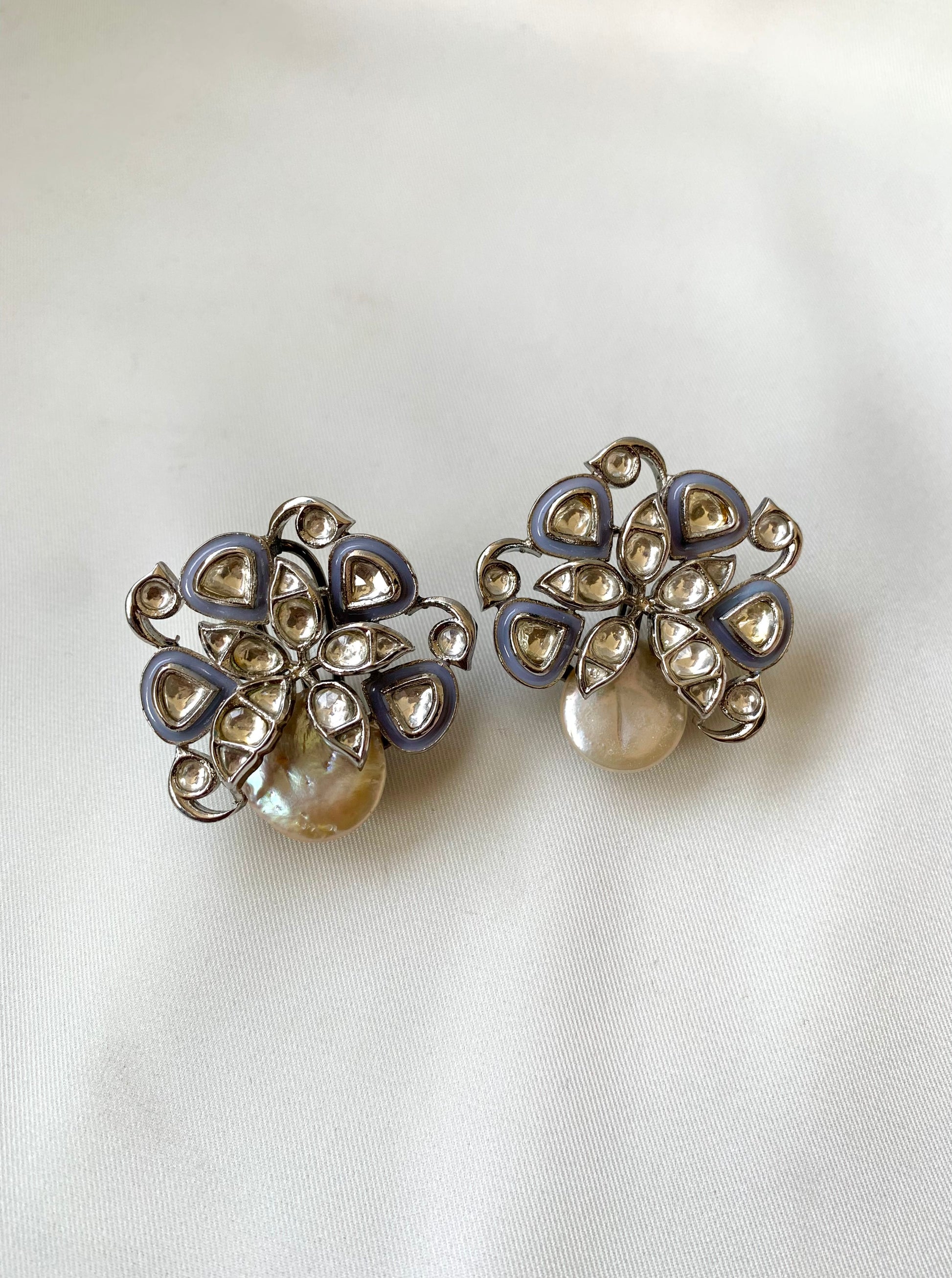 Serwa Grey rhodium plated signature studs with baroque pearls and polki kundan meena detailing