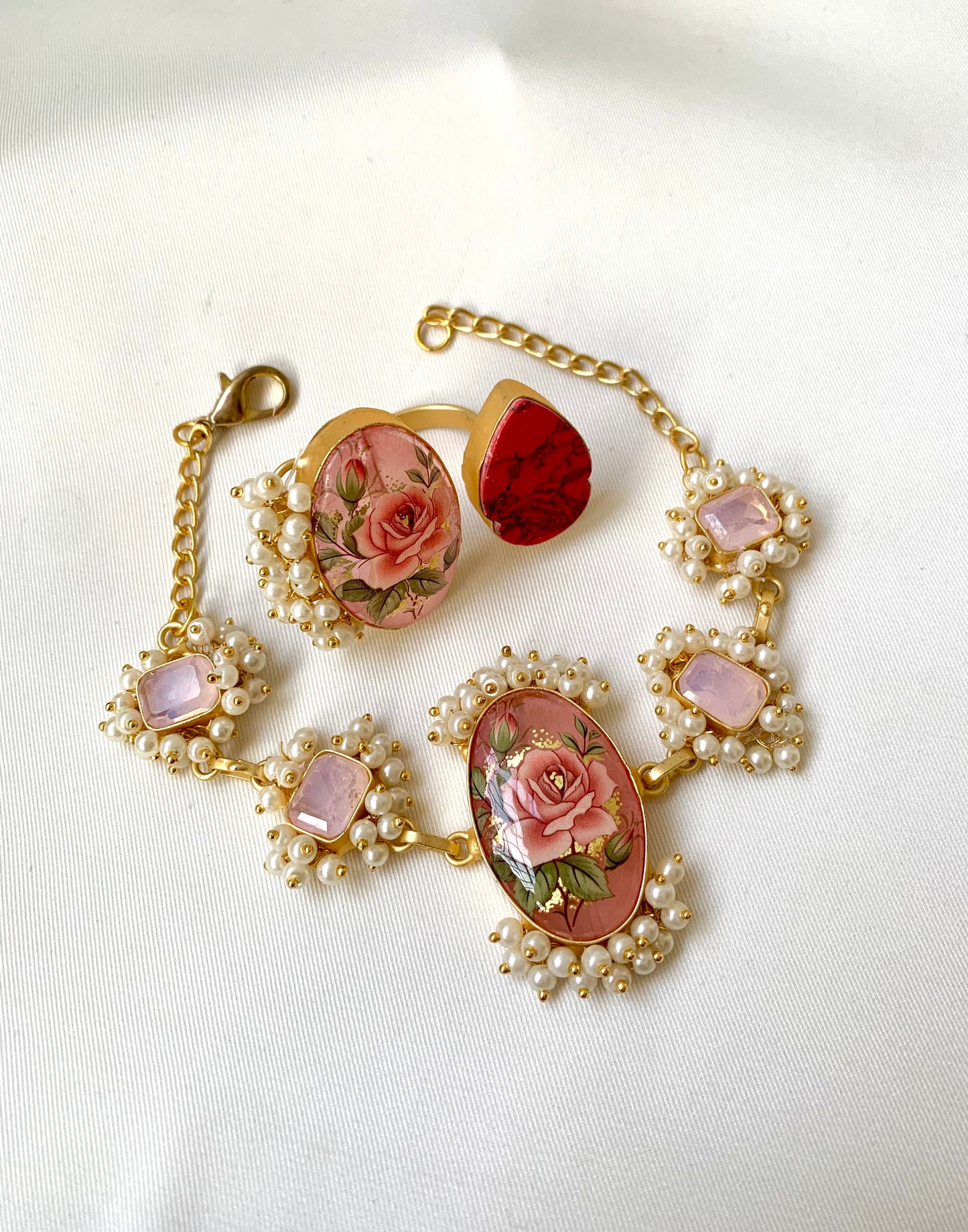 Shehnai Combo Set featuring handcrafted gold plated bracelet and adjustable ring with pearls, ruby and hand painted Tansa beads