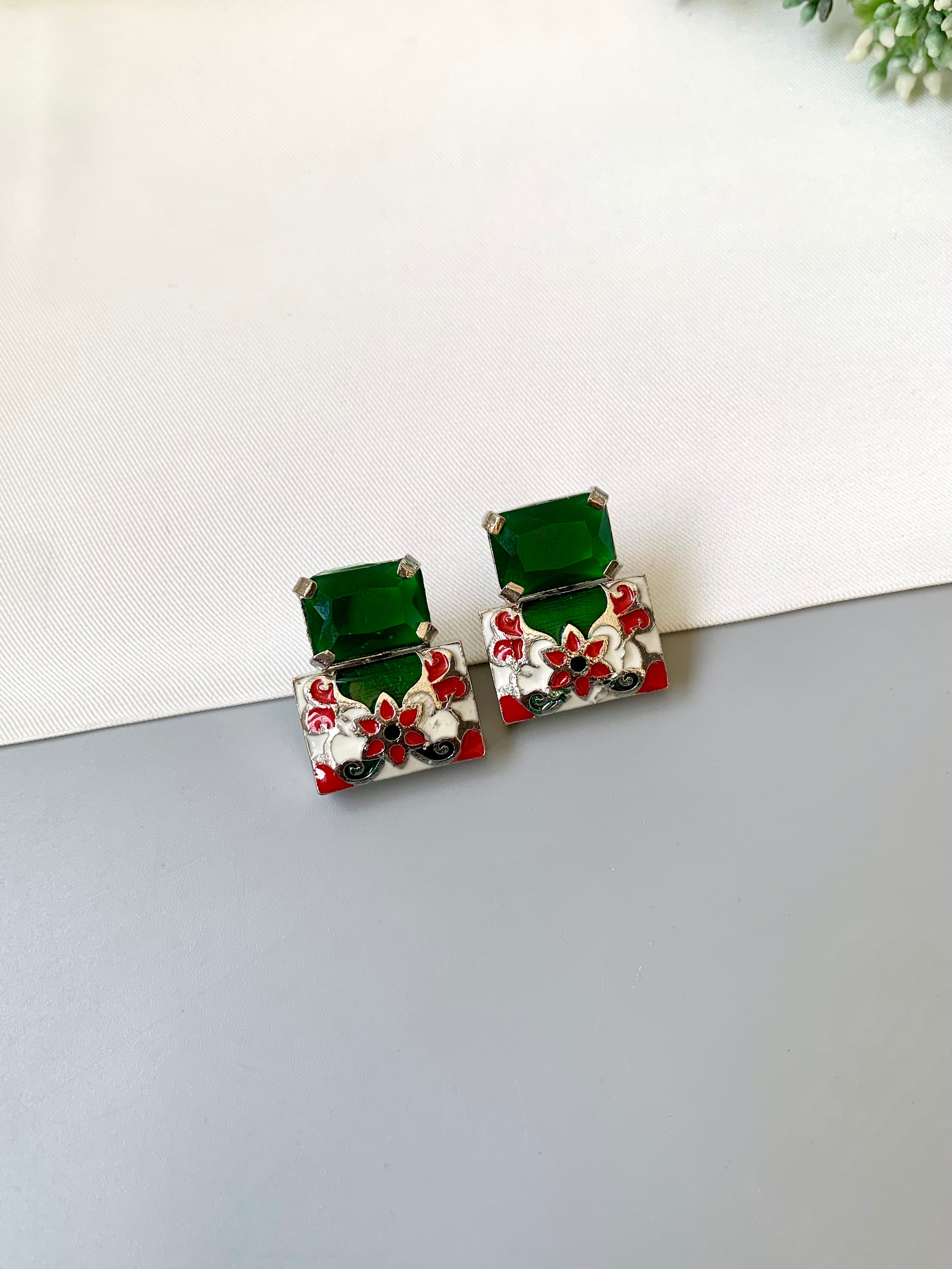 Simona emerald meena studs in rhodium plating with semi precious emerald stone