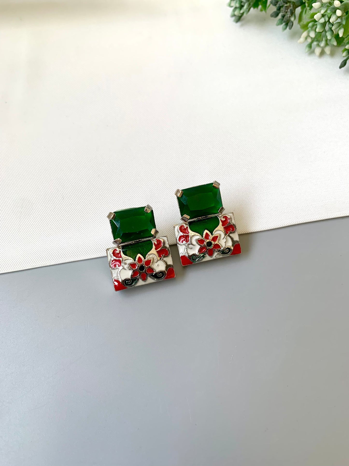 Simona emerald meena studs in rhodium plating with semi precious emerald stone