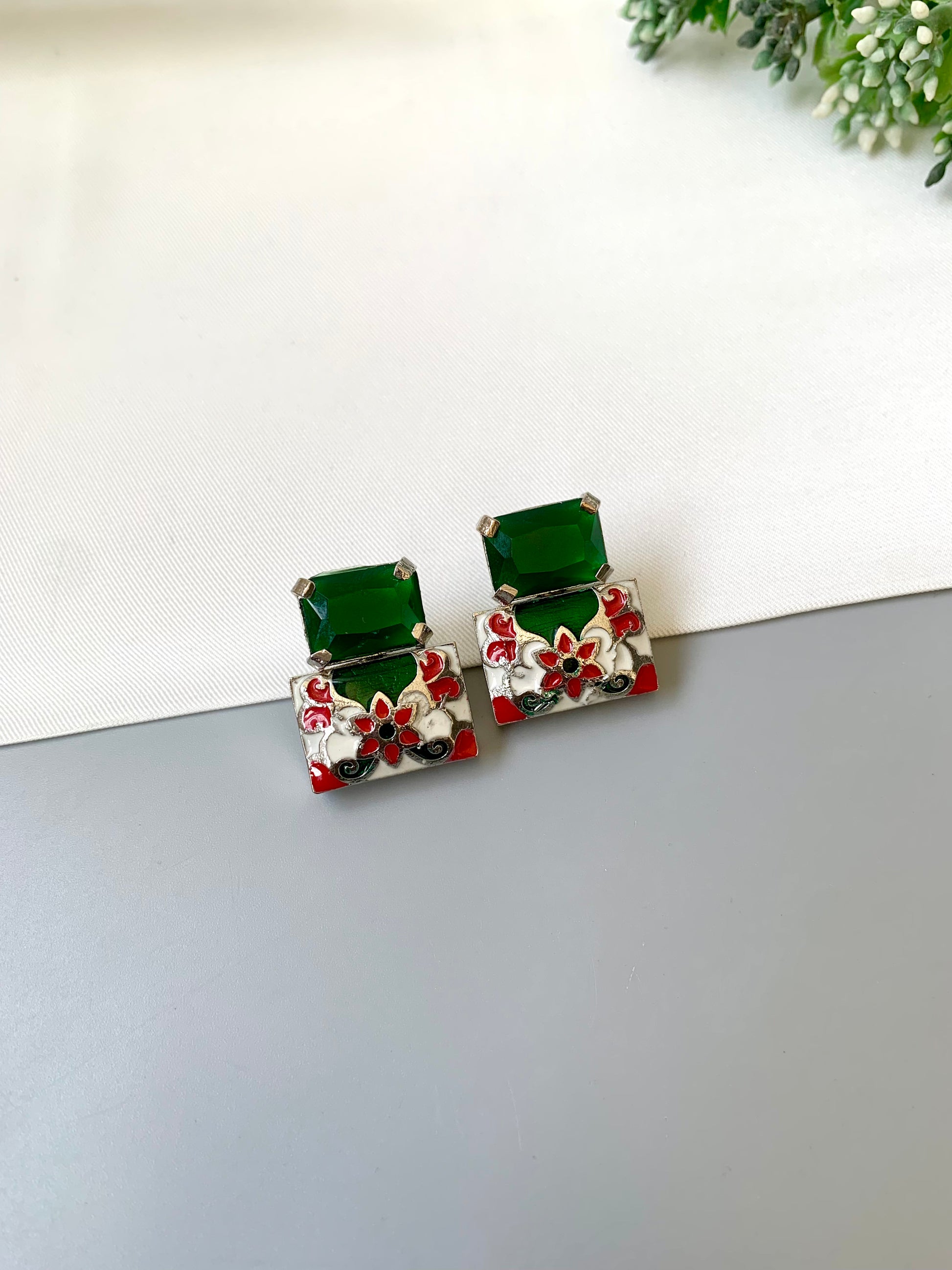 Simona emerald meena studs in rhodium plating with semi precious emerald stone