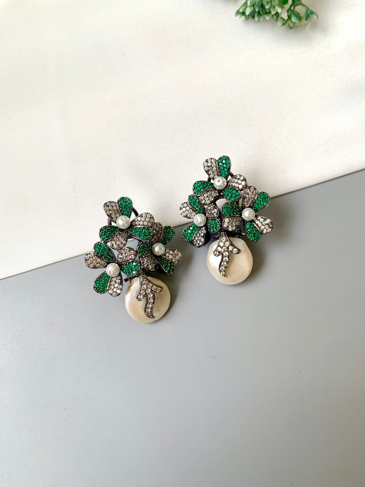 Sivah handcrafted rhodium oxidized signature earrings with baroque pearls and emerald Swarovski crystals