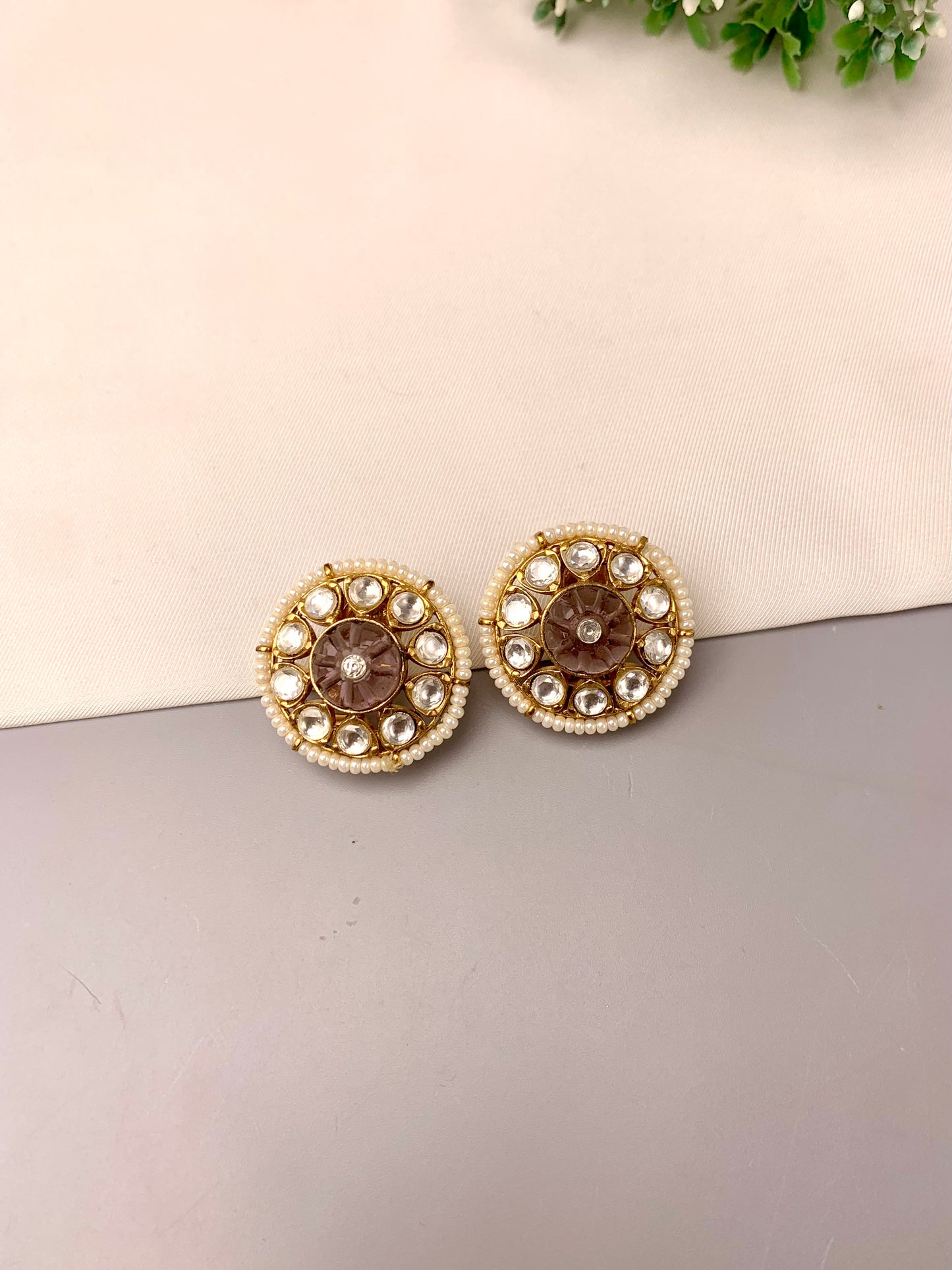 Sofi handcrafted 22kt gold plated studs featuring Polki Kundan, semi-precious hand-carved Amethyst, and Pearls