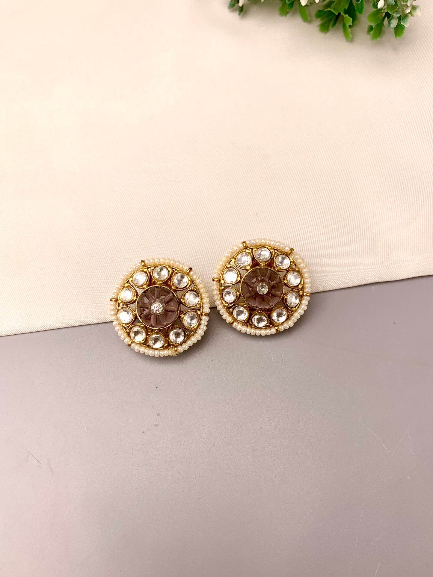 Sofi handcrafted 22kt gold plated studs featuring Polki Kundan, semi-precious hand-carved Amethyst, and Pearls
