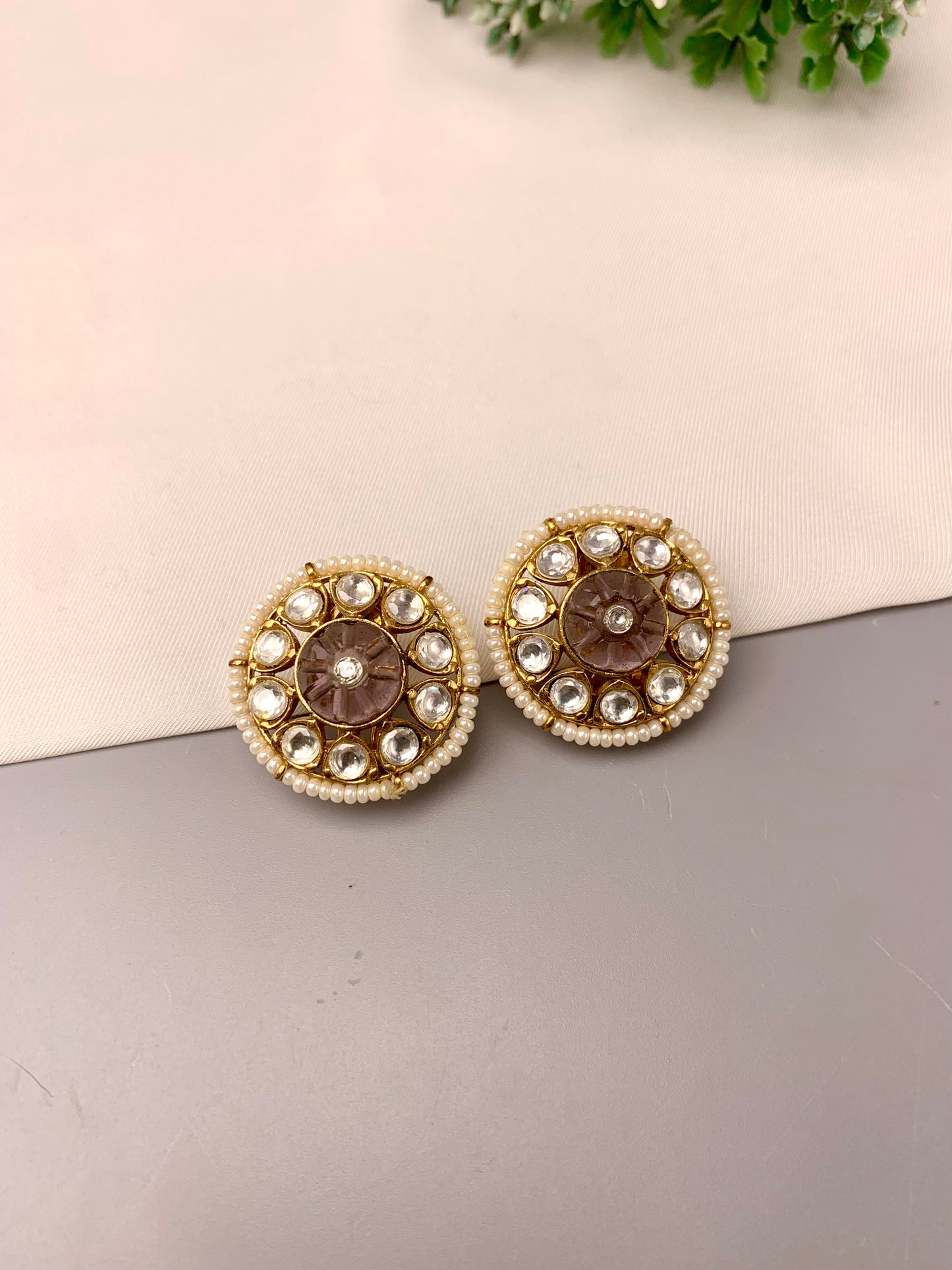 Sofi handcrafted 22kt gold plated studs featuring Polki Kundan, semi-precious hand-carved Amethyst, and Pearls