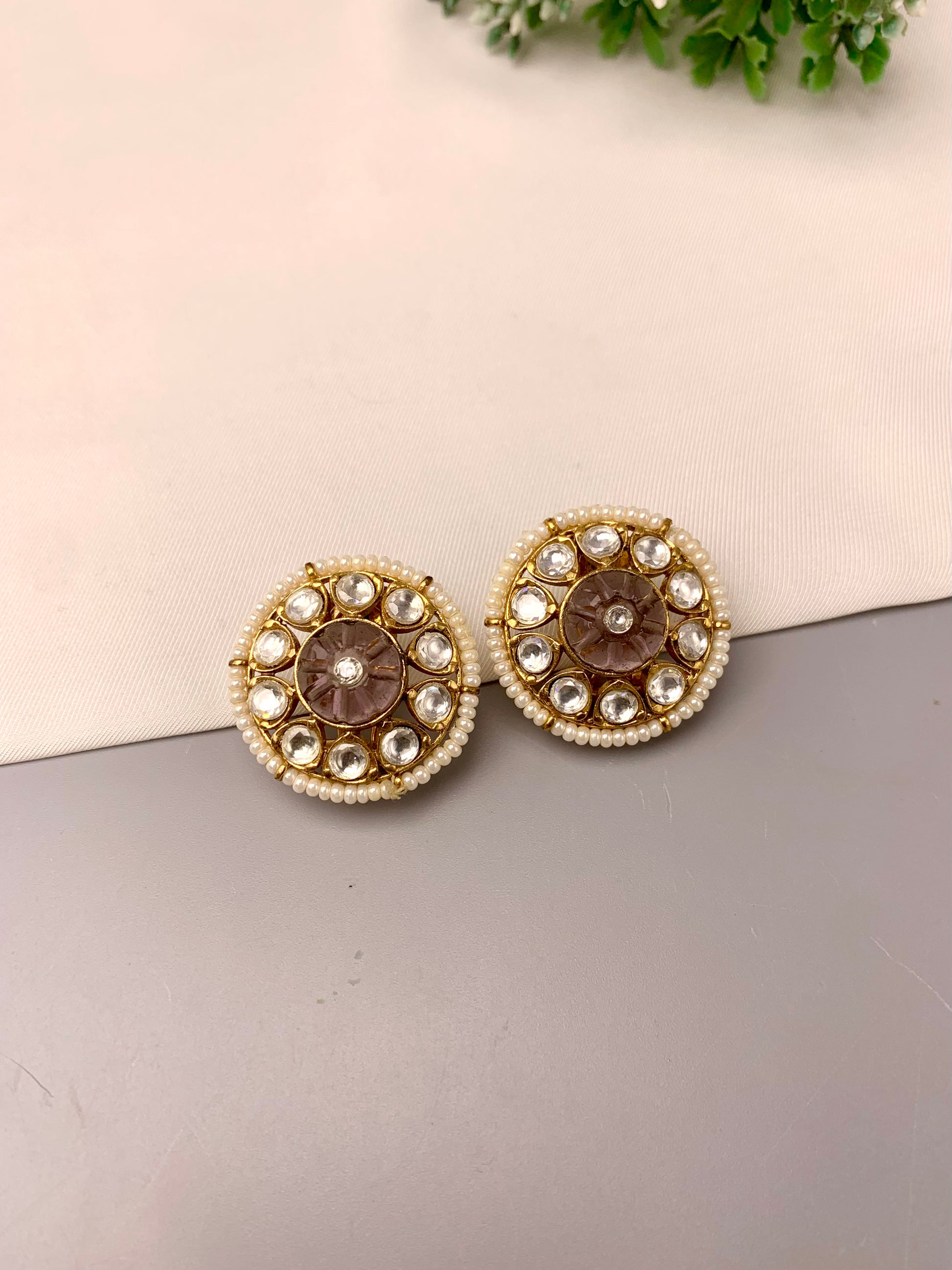 Sofi handcrafted 22kt gold plated studs featuring Polki Kundan, semi-precious hand-carved Amethyst, and Pearls