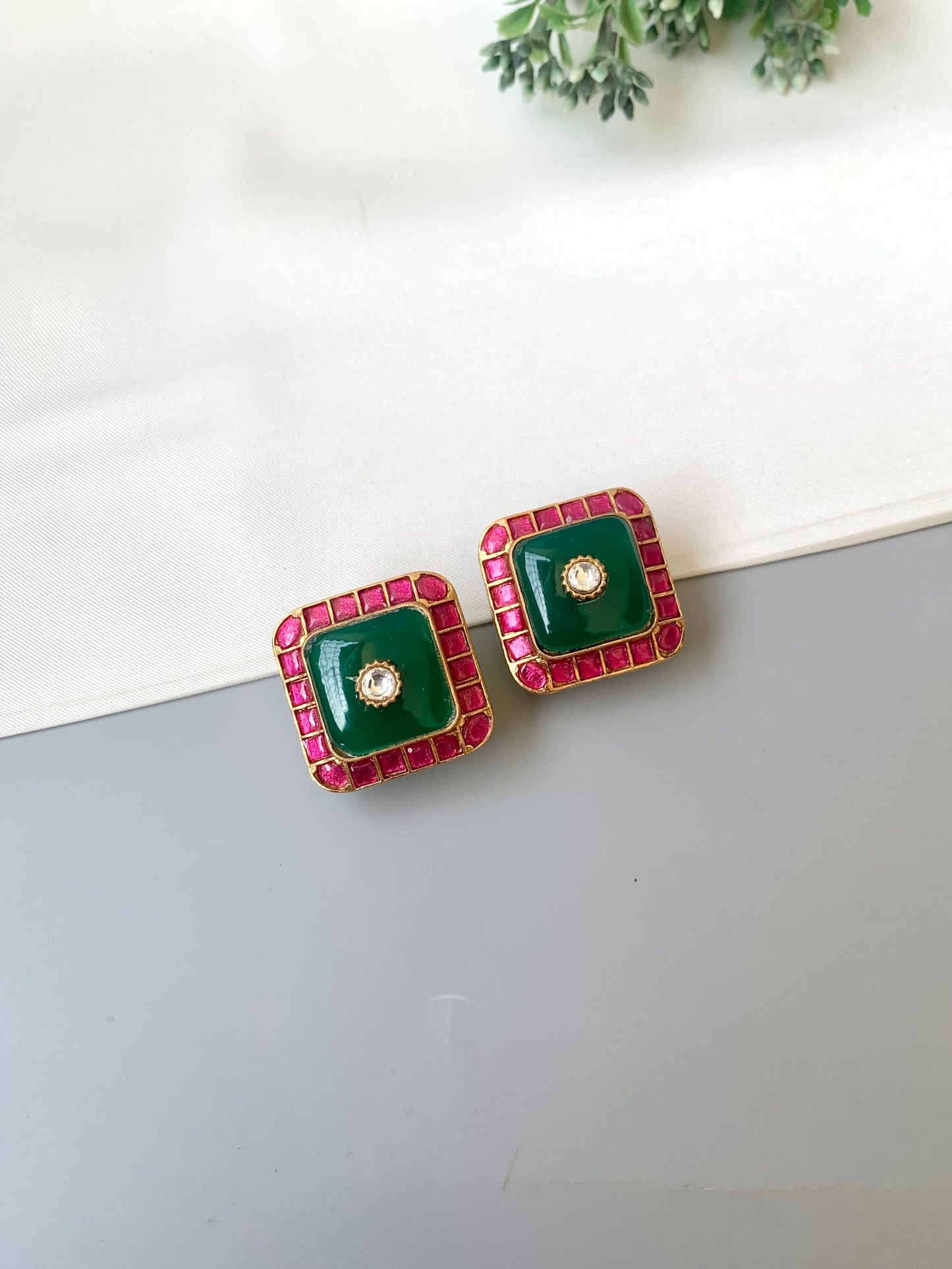 Sofi ruby moissanite kundan studs in victorian gold plating with emerald accents