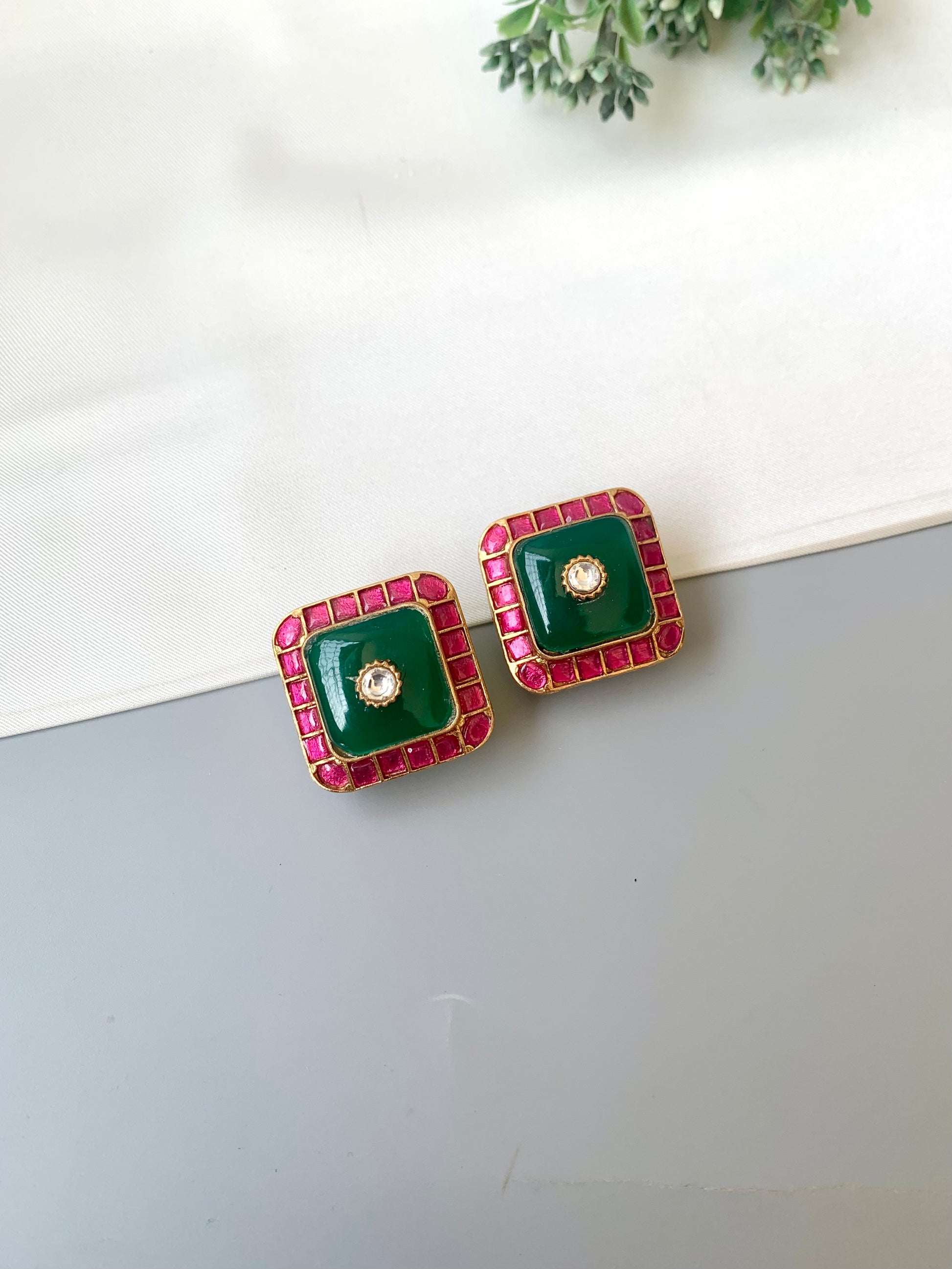 Sofi ruby moissanite kundan studs in victorian gold plating with emerald accents