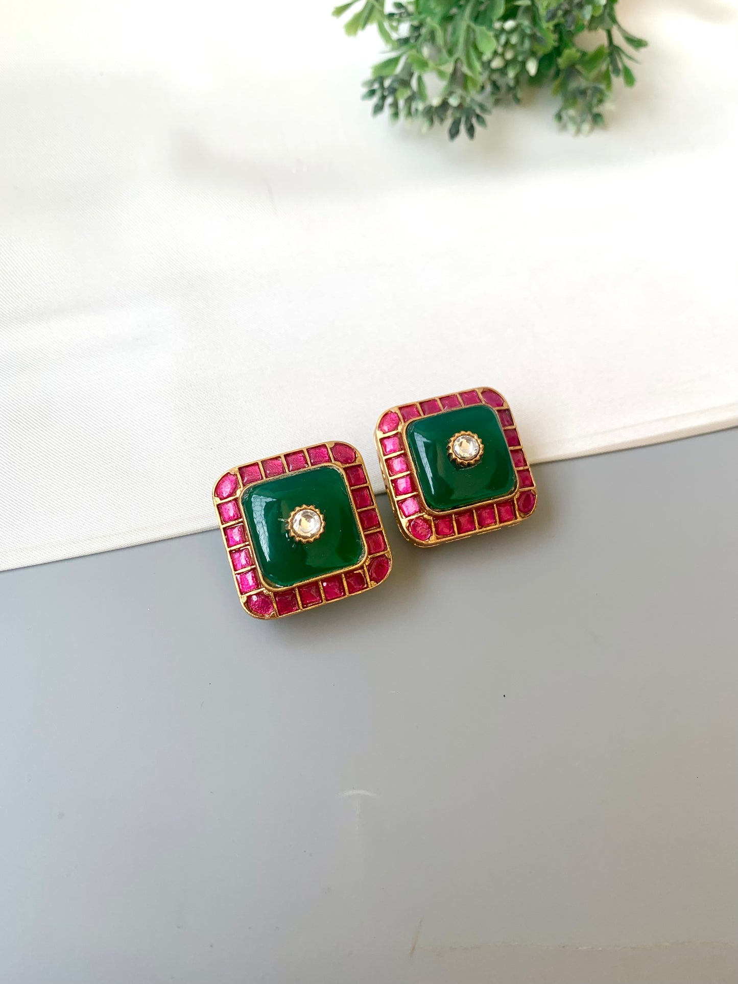Sofi ruby moissanite kundan studs in victorian gold plating with emerald accents